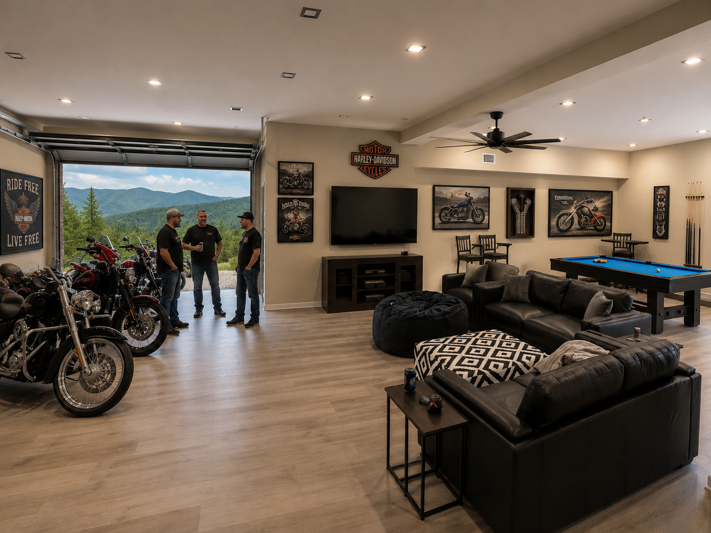 Indoor garage with bookshelves, mounted TV, bicycle, pool table, sectional sofa, small side table, and three men in casual clothing talking near open garage door revealing hilly landscape with trees.
