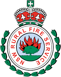 Badge of the NSW Rural Fire Service with a red fire flame, green tree, and wreath.