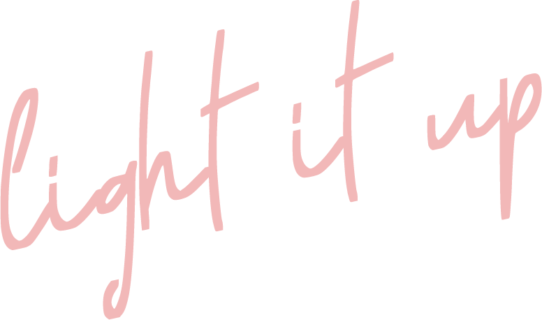 Pink handwritten text that says "light it up."
