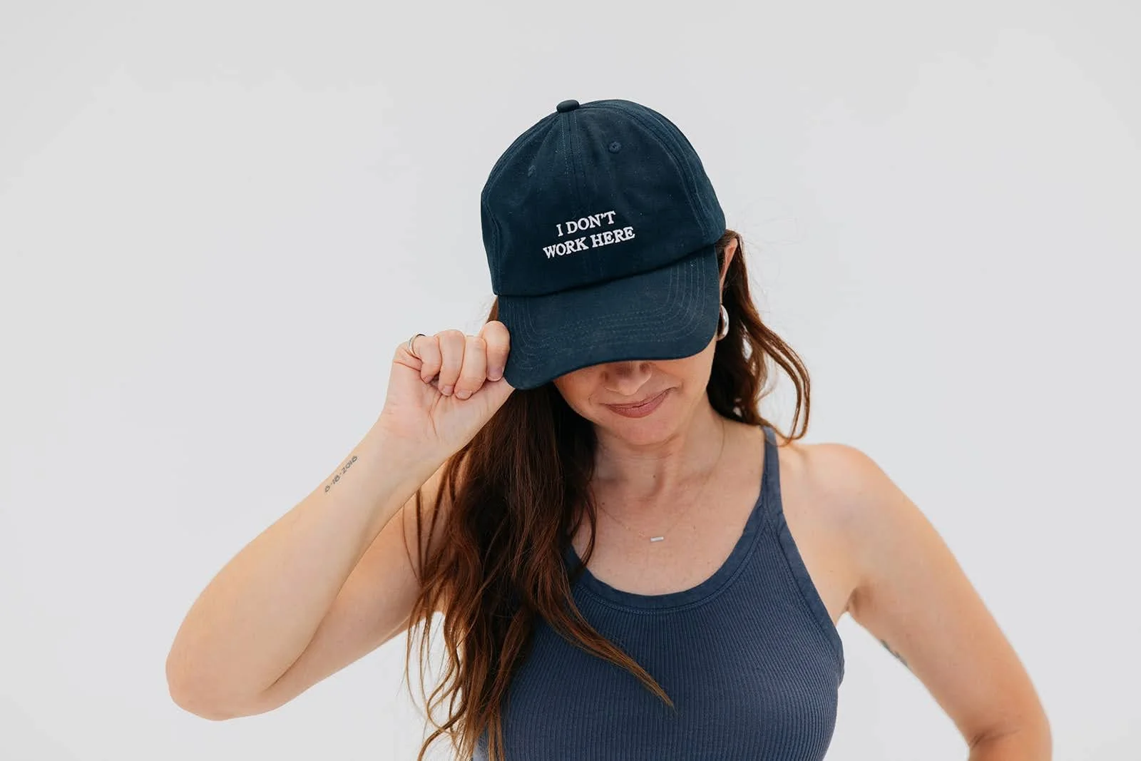 Allison Blackwell wearing a cap and tank top