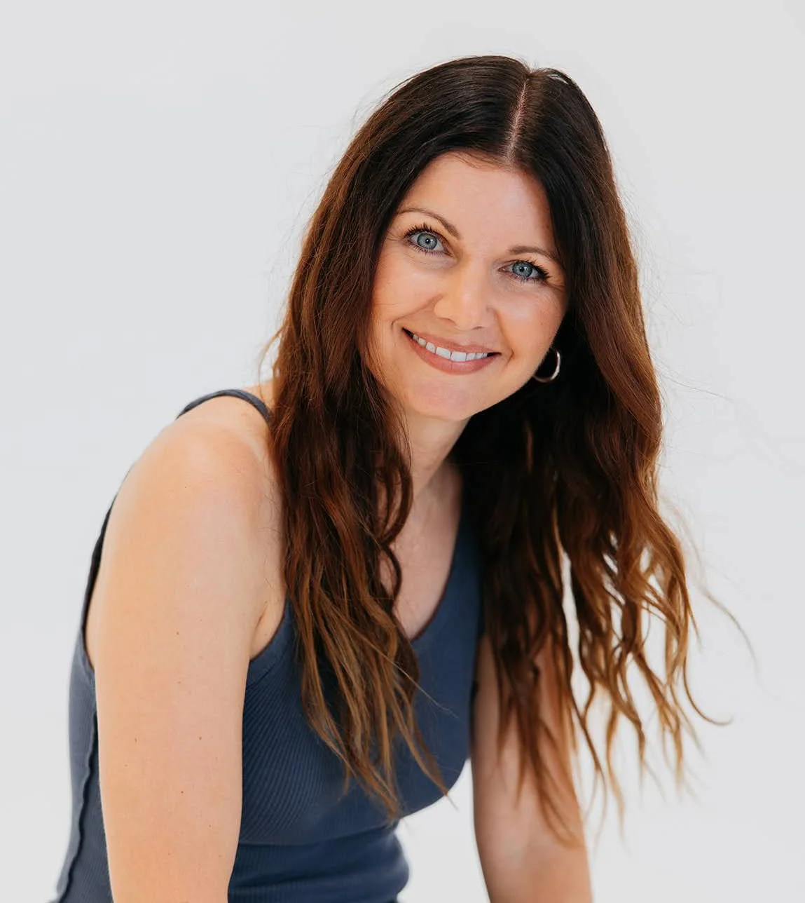 Allison Blackwell smiling in a navy blue top