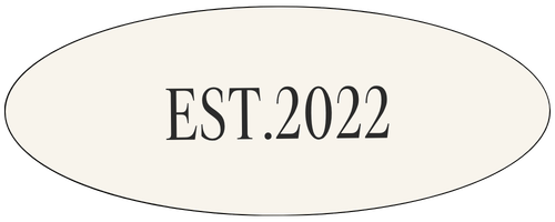 An oval-shaped sign with the text "EST. 2022" in black font.