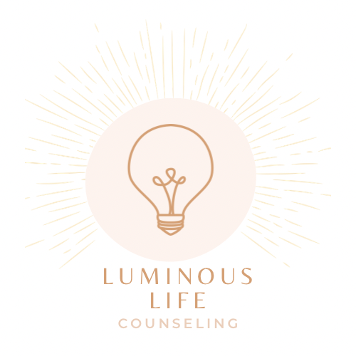 A drawing of a lightbulb giving off light with the caption Luminous Life Counseling beneath it