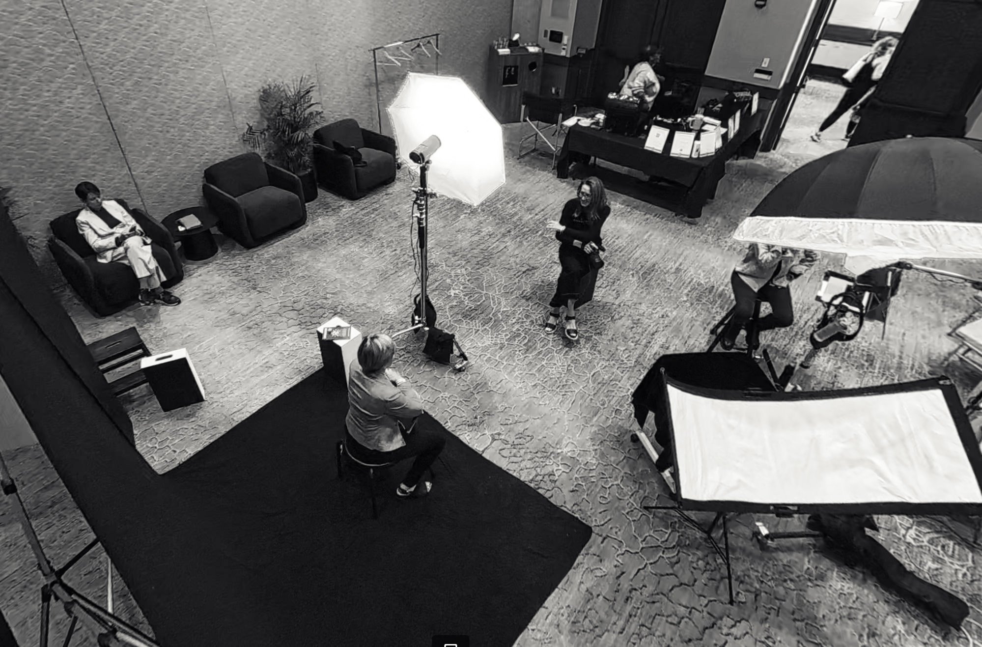 Black-and-white overhead view of The Portrait Lounge headshot experience set up during a professional summit at JW Marriott Camelback Inn.