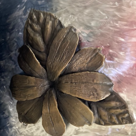 With guidance from sculptor and friend Manuelita Brown, I created seven bronze flowers, and she created the figure and the Kumeyaay Native American Hut in San Diego. "Jasmine" By Judy Salinsky
