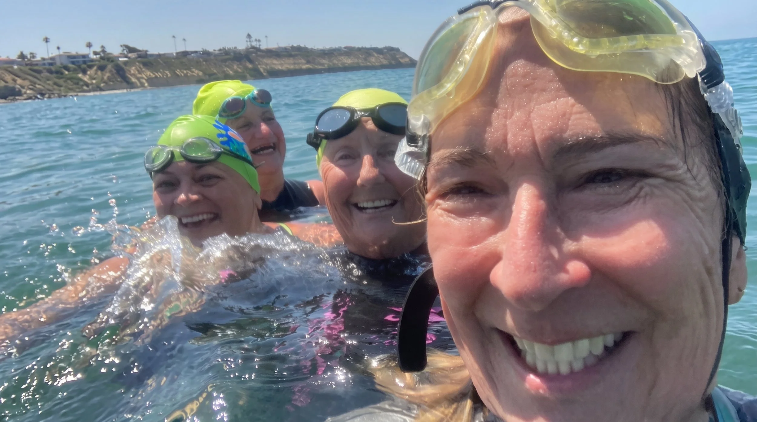 The artist Judy Salinsky and friends in the ocean