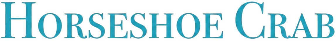 Close-up of a colorful sign that reads 'HORSESHOE CRAB' in large turquoise letters.