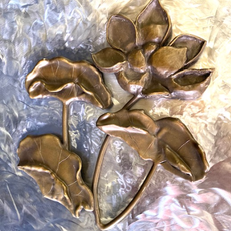 With guidance from sculptor and friend Manuelita Brown, I created seven bronze flowers, and she created the figure and the Kumeyaay Native American Hut in San Diego. "Lotus" By Judy Salinsky