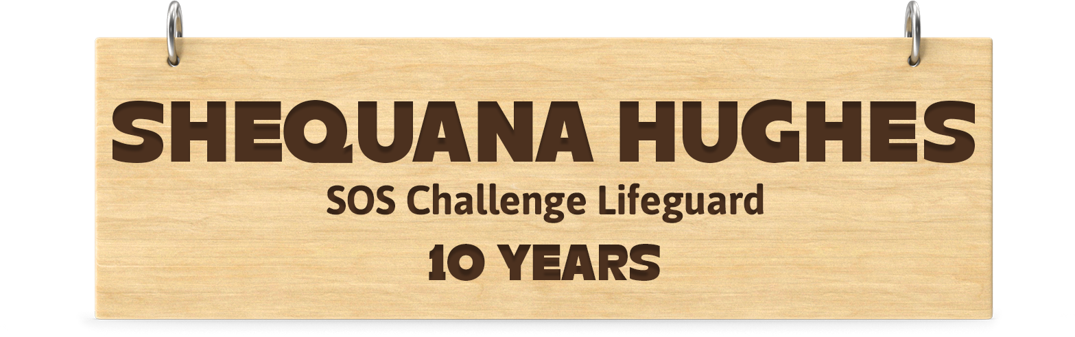 Engraved wooden board. Engraved text: Shequana Hughes SOS Challenge Lifeguard 10 Years