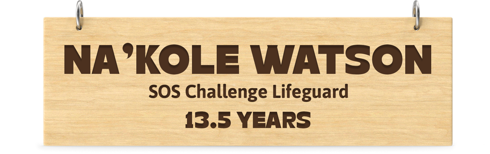 Engraved wooden board. Engraved text: Na'Kole Watson SOS Challenge Lifeguard 13.5 Years