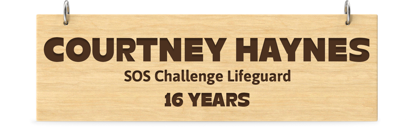 Engraved wooden board. Engraved text: Courtney Haynes SOS Challenge Lifeguard 16 Years