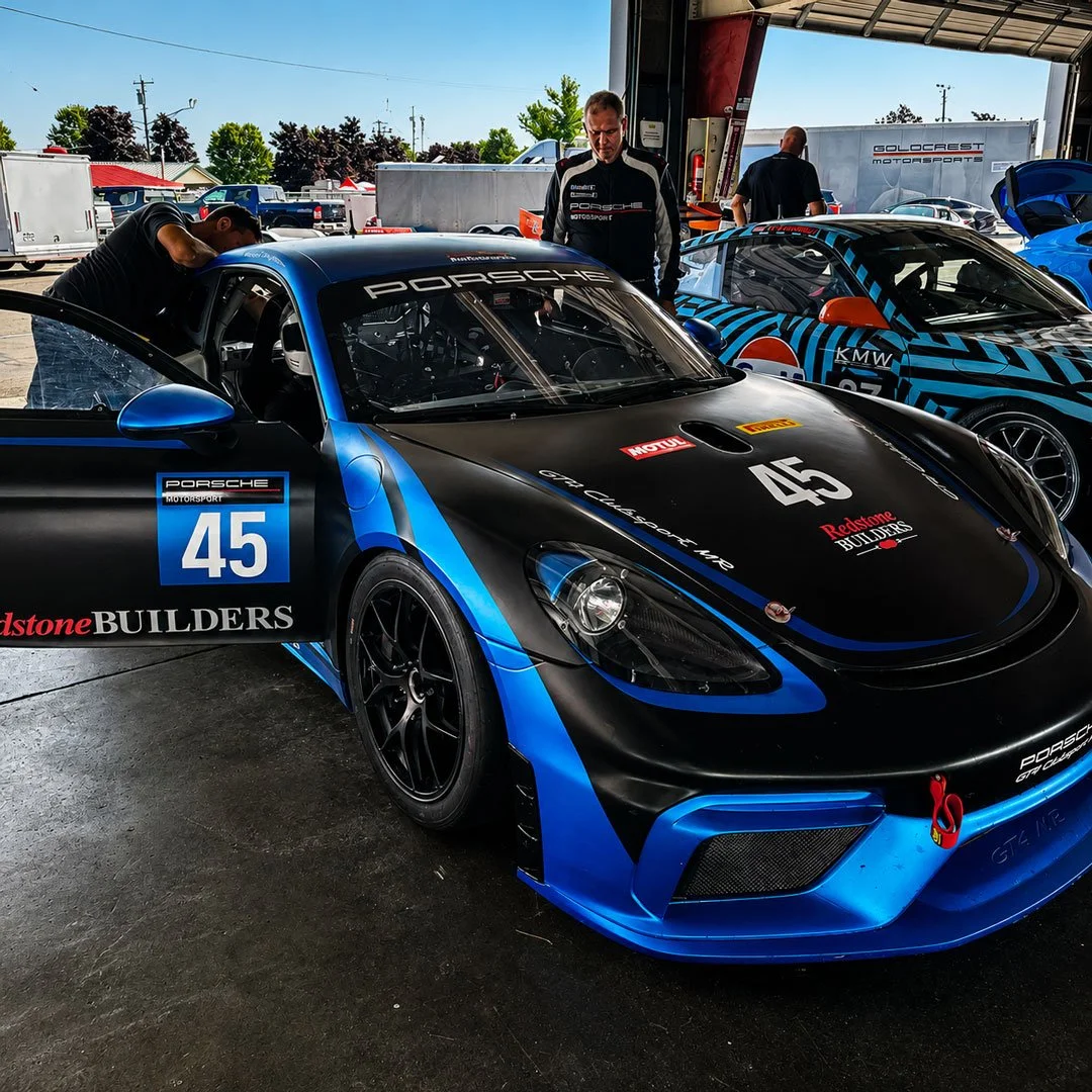 Blue & Black Race Car in Paddock