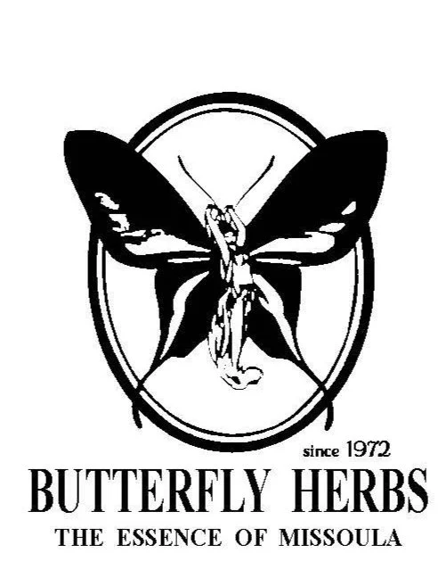 Logo of Butterfly Herbs featuring a butterfly with humanoid figure in the center, surrounded by an oval border, with text 'since 1972', 'Butterfly Herbs', and 'The Essence of Missoula'.