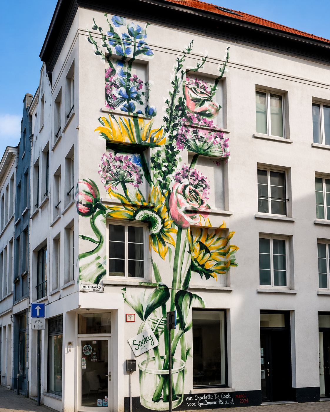 A floral mural by Antwerp-based artist Charlotte De Cock on a WAVE building in Antwerp.