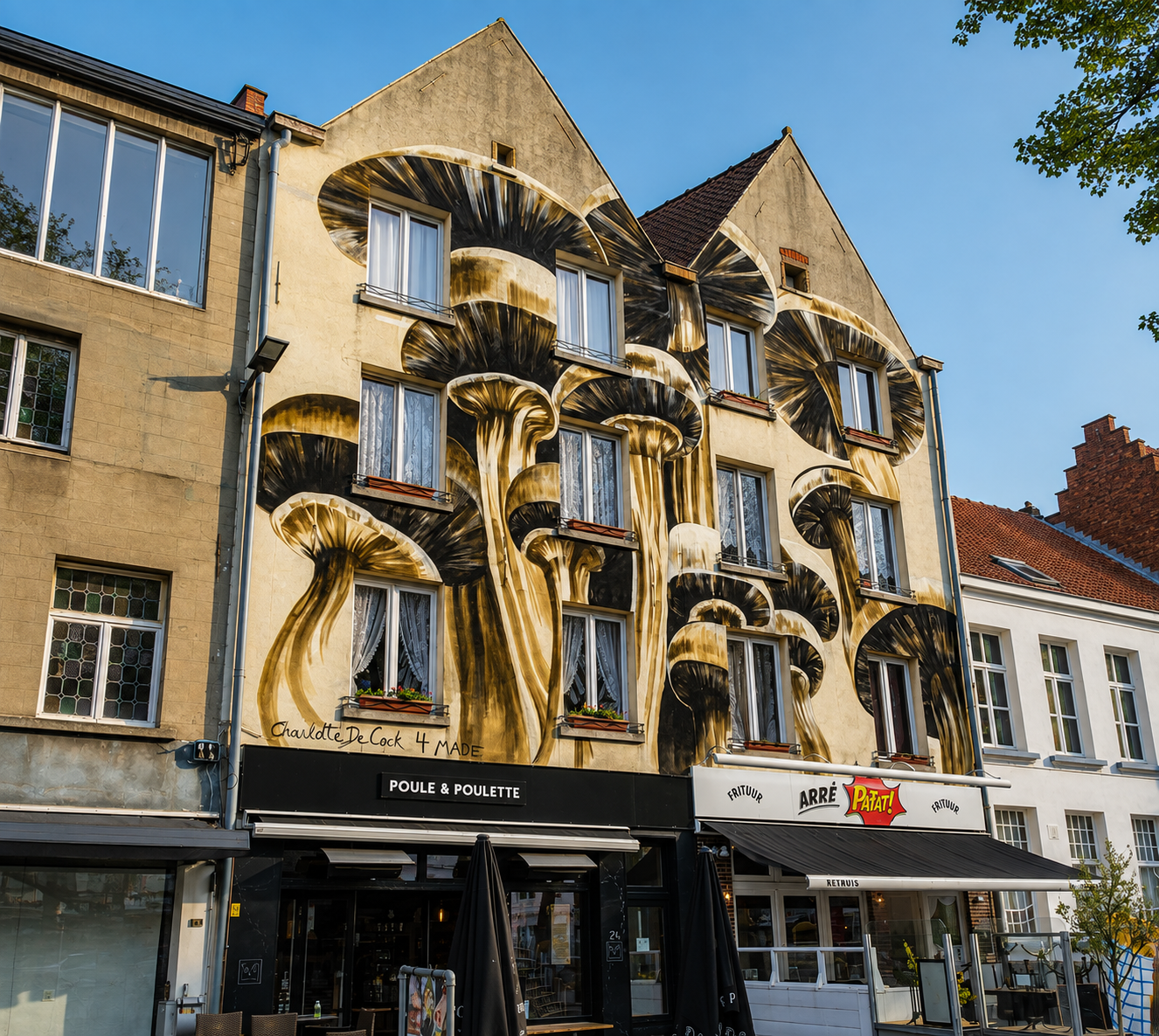 A striking mushroom mural by Antwerp-based artist Charlotte De Cock on a WAVE building in Antwerp.