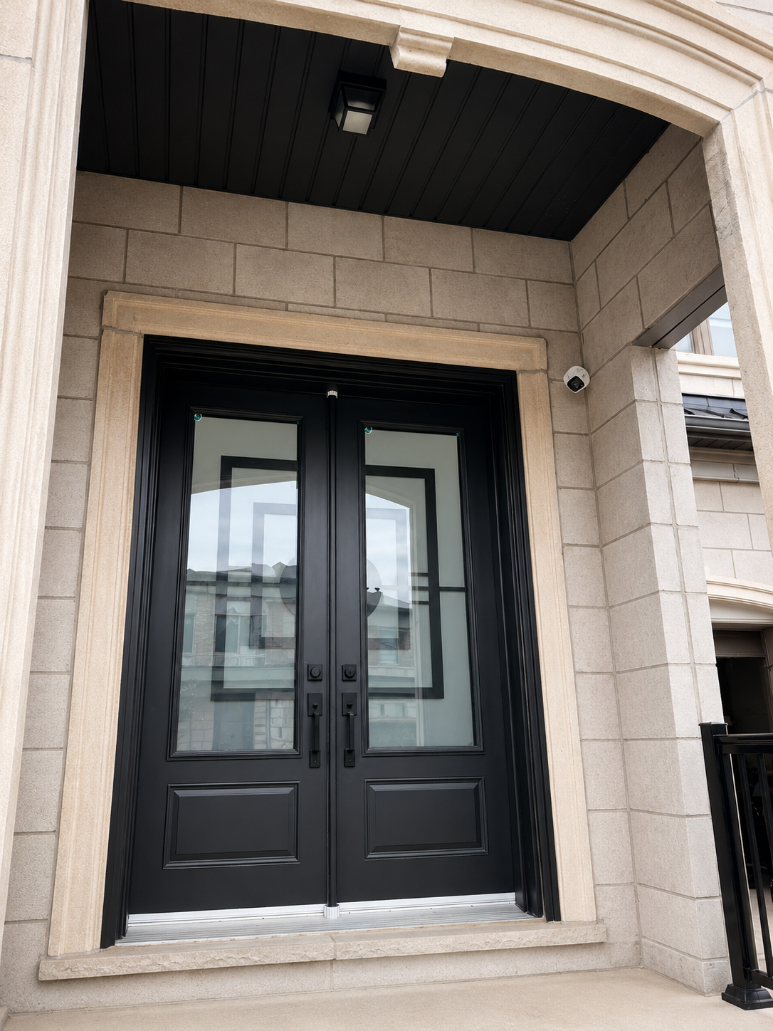 Security camera installed at the entrance of an upscale Burlington home by SKJ Home Solutions.