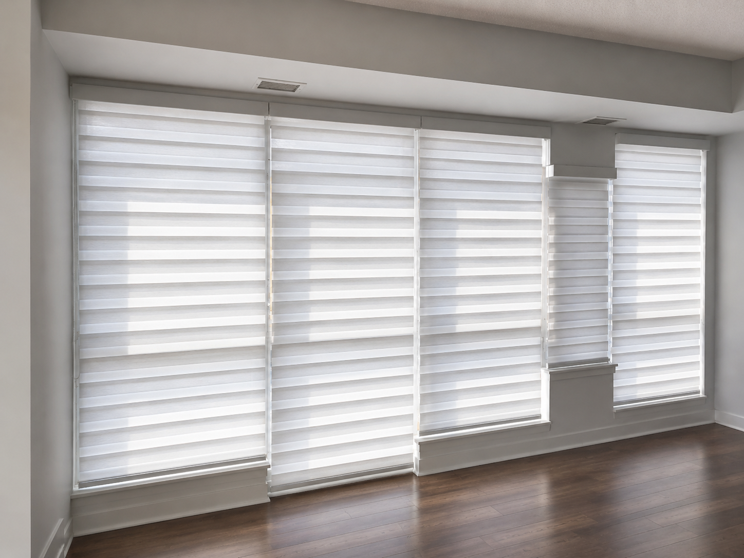 Toronto Condo with Multiple windows recieving the zebra blinds by SKJ Home Solutions