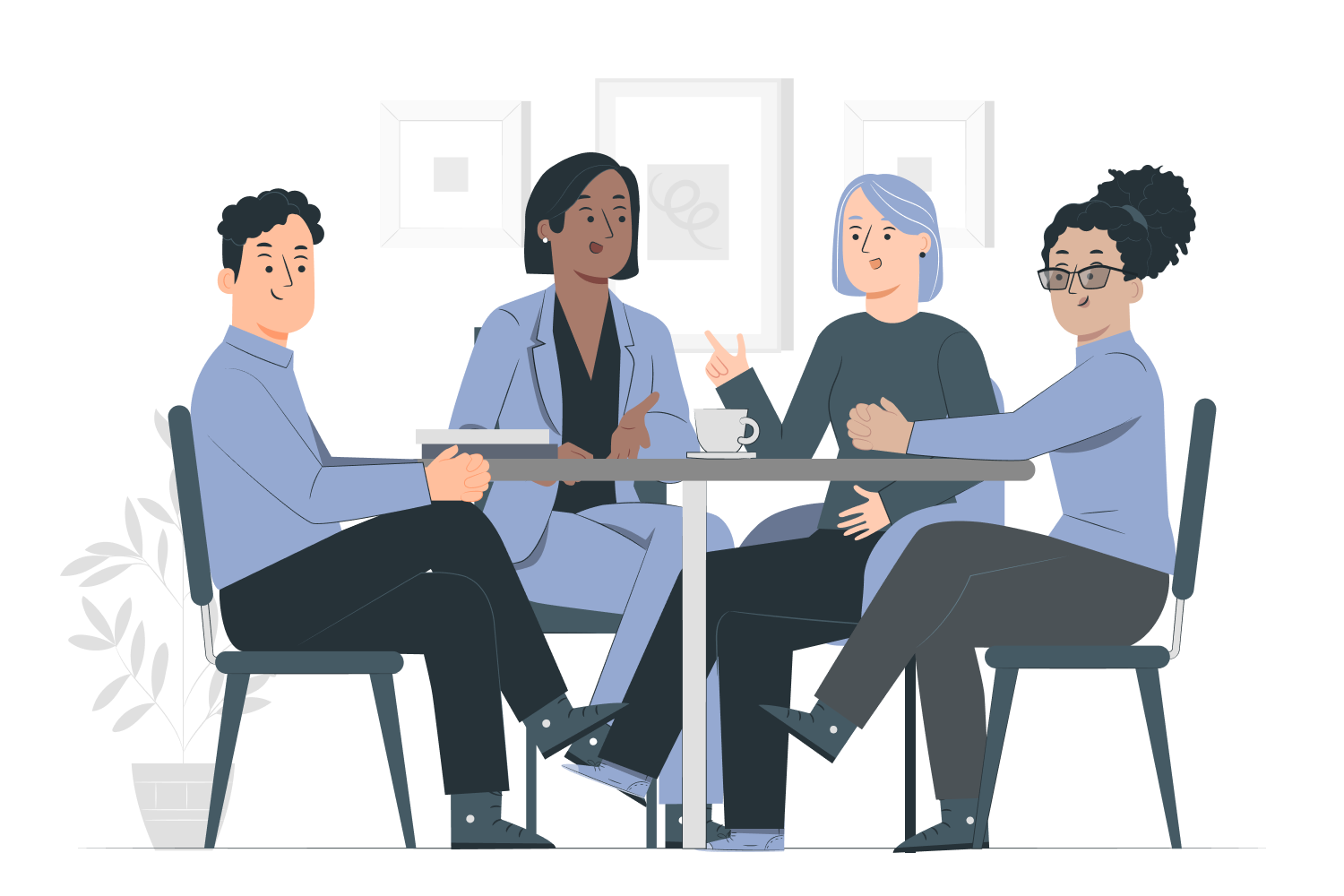 A group of four people sitting around a table having a discussion.