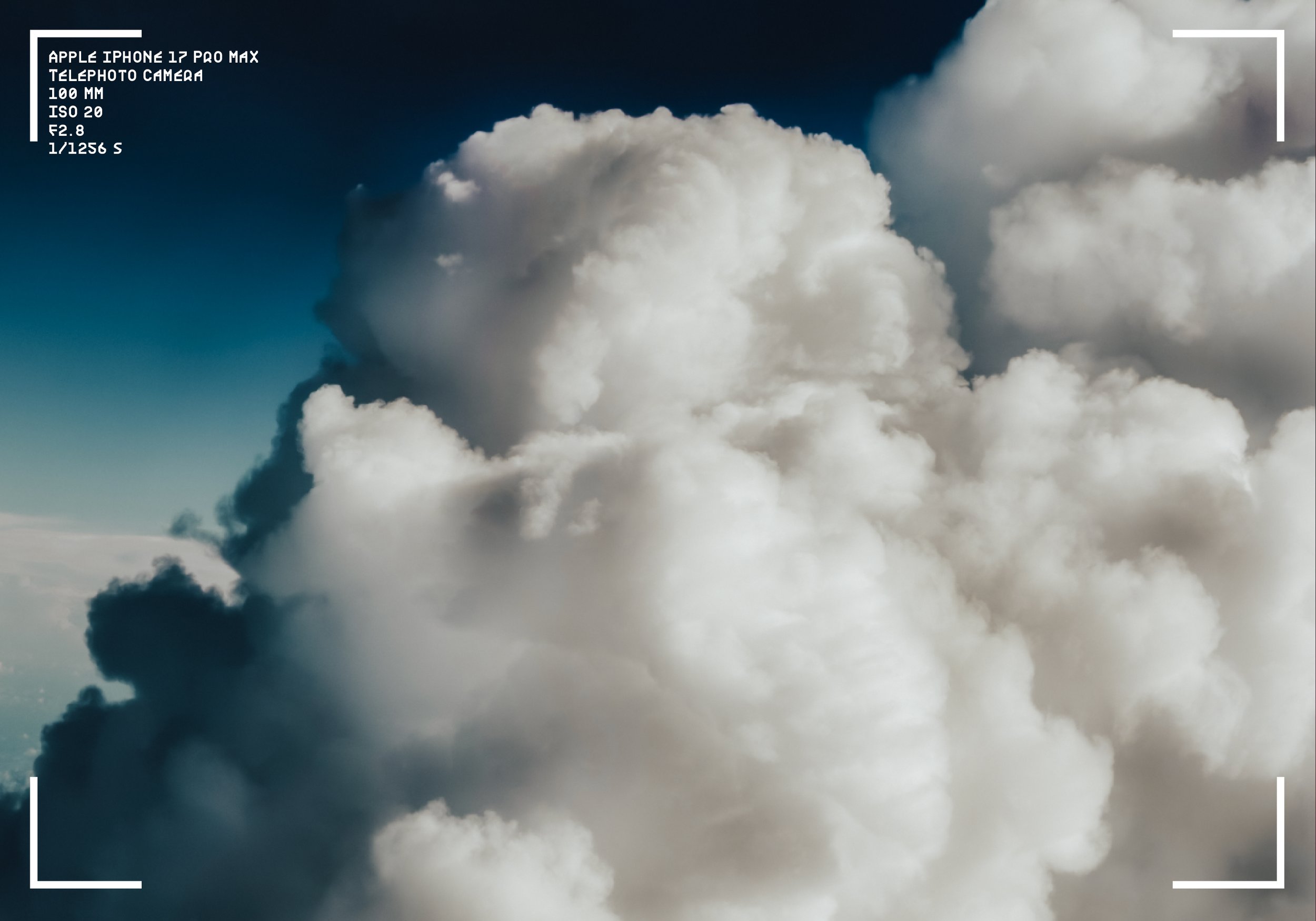 Clouds in the sky with a focus on large, white, fluffy clouds against a blue sky.