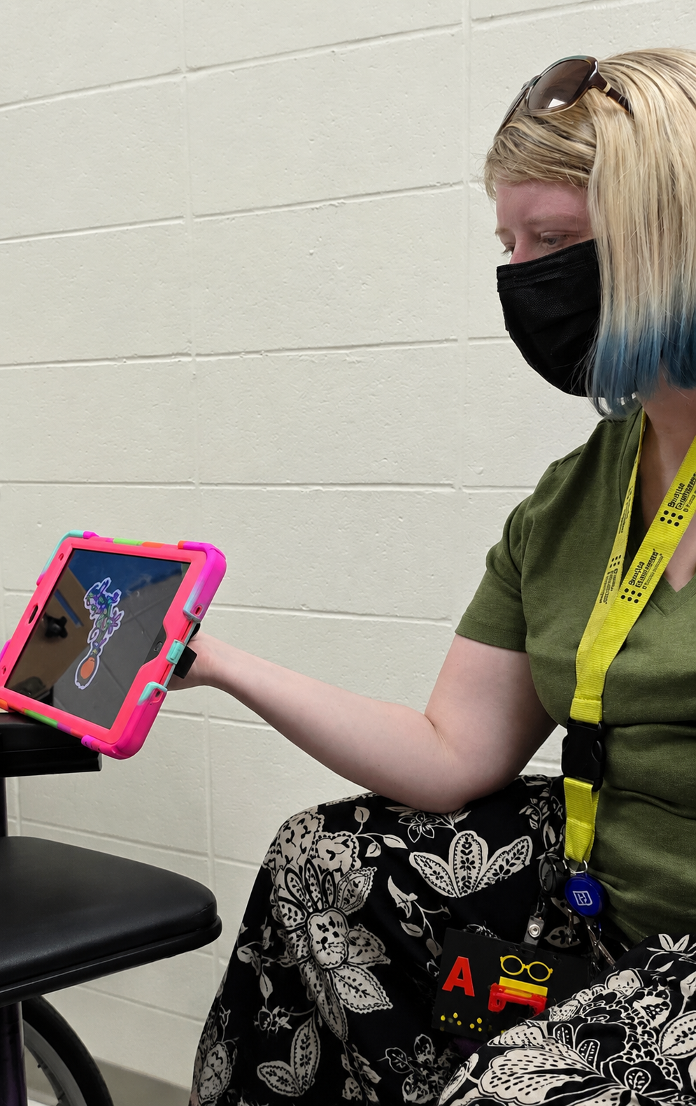 Ashley Whitt using an accessible tablet device as part of her work as a Teacher of the Visually Impaired (TVI).