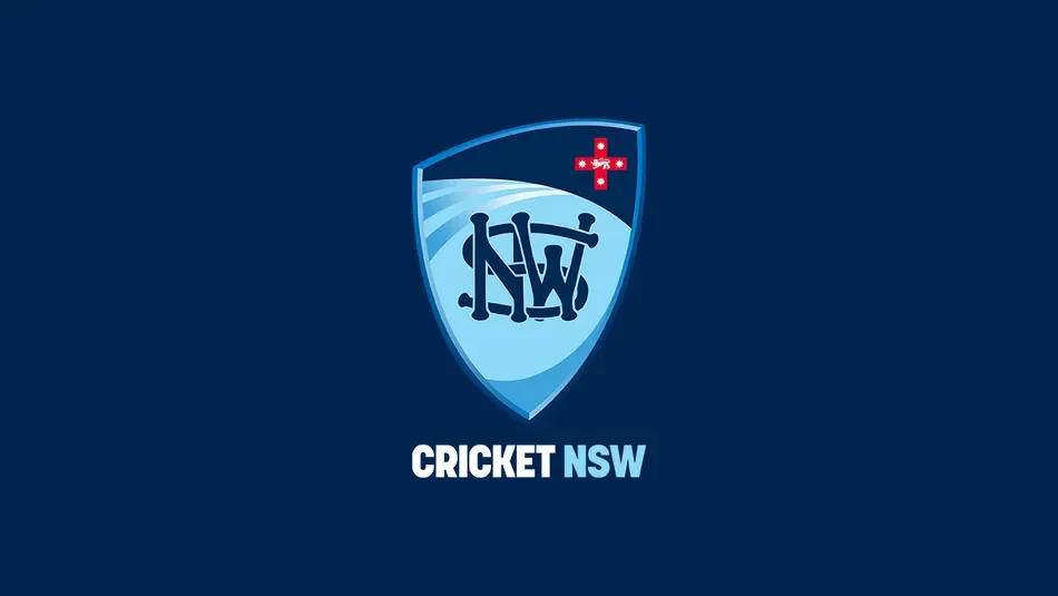Cricket NSW logo featuring a shield with a stylized cricket bat and ball, and the Australian flag, with text 'CRICKET NSW' below.