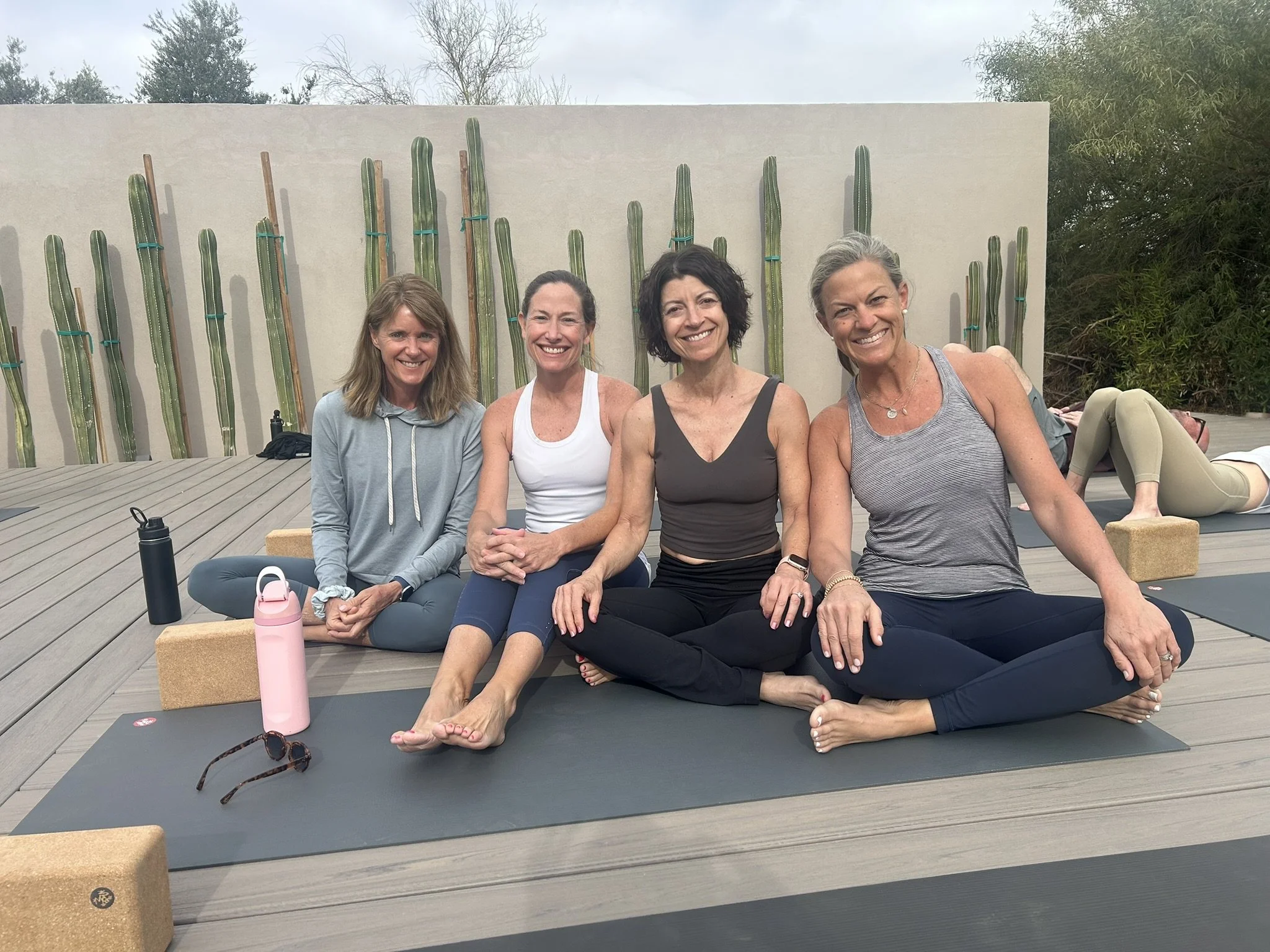 Women practicing yoga at the Root to Rise retreat in the Sequoia Mountains