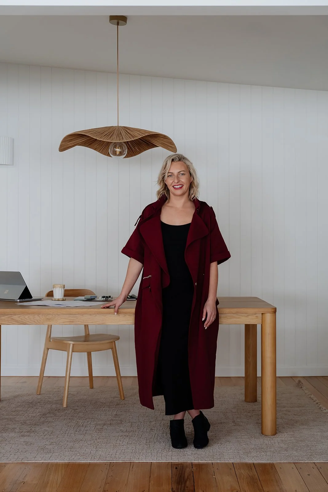 Gemma standing at studio desk