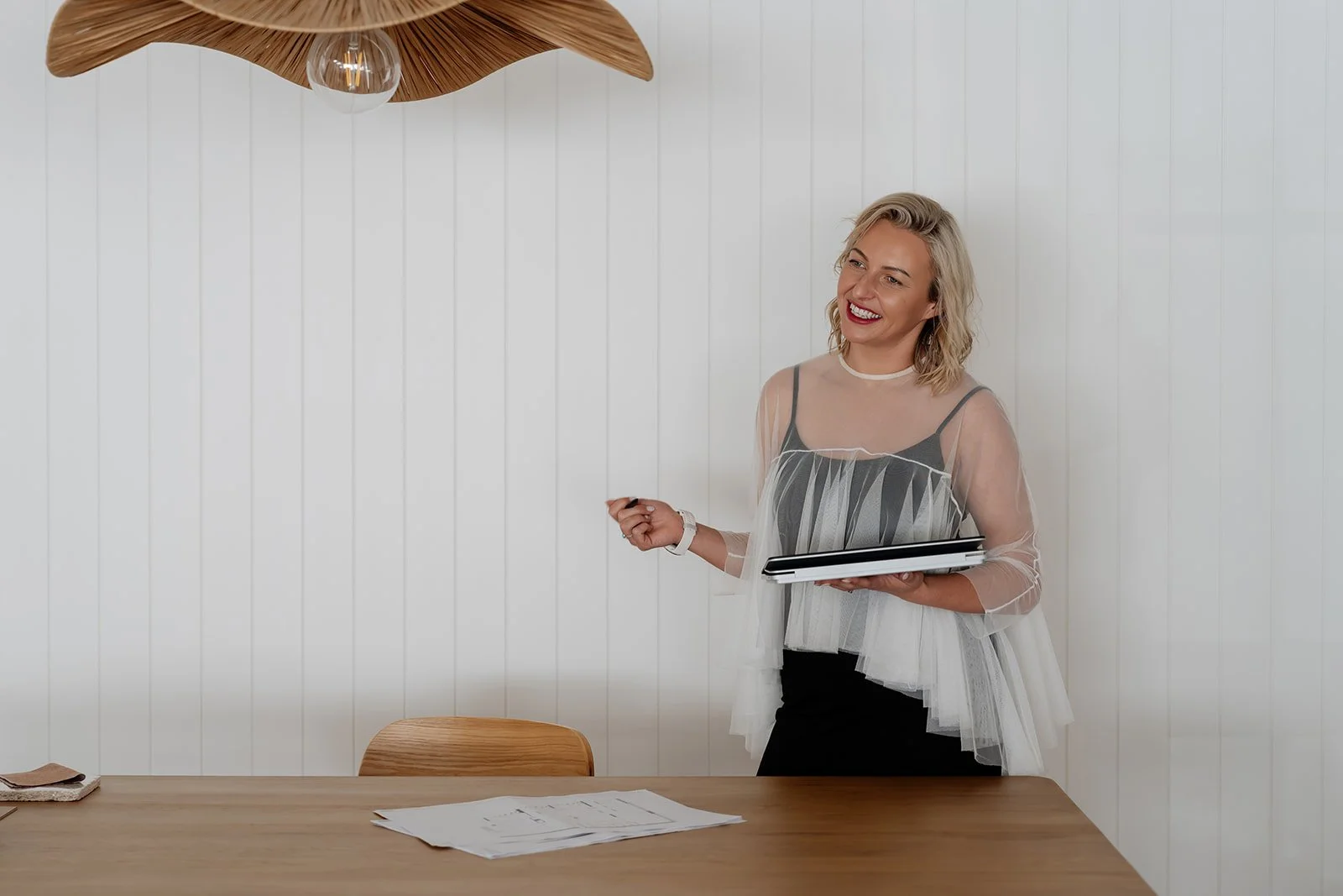 Gemma standing at desk