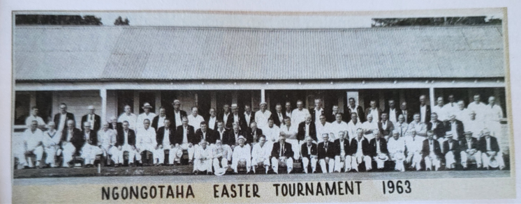 Historical black and white photo of a large group of people gathered for Ngongotaha Easter Tournament in 1963, posing in front of a building.