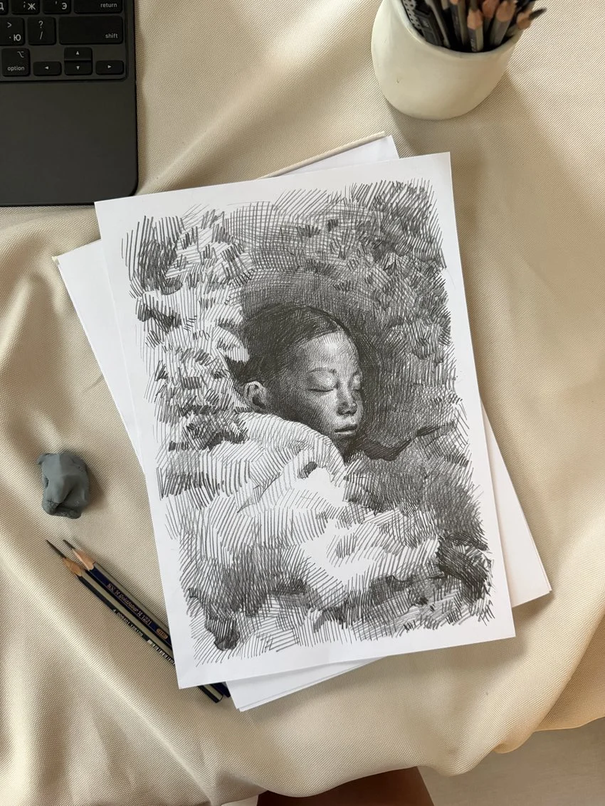 Sleeping child's face with closed eyes, framed in dense pencil hatching, from The In-Between by Marina Ogai