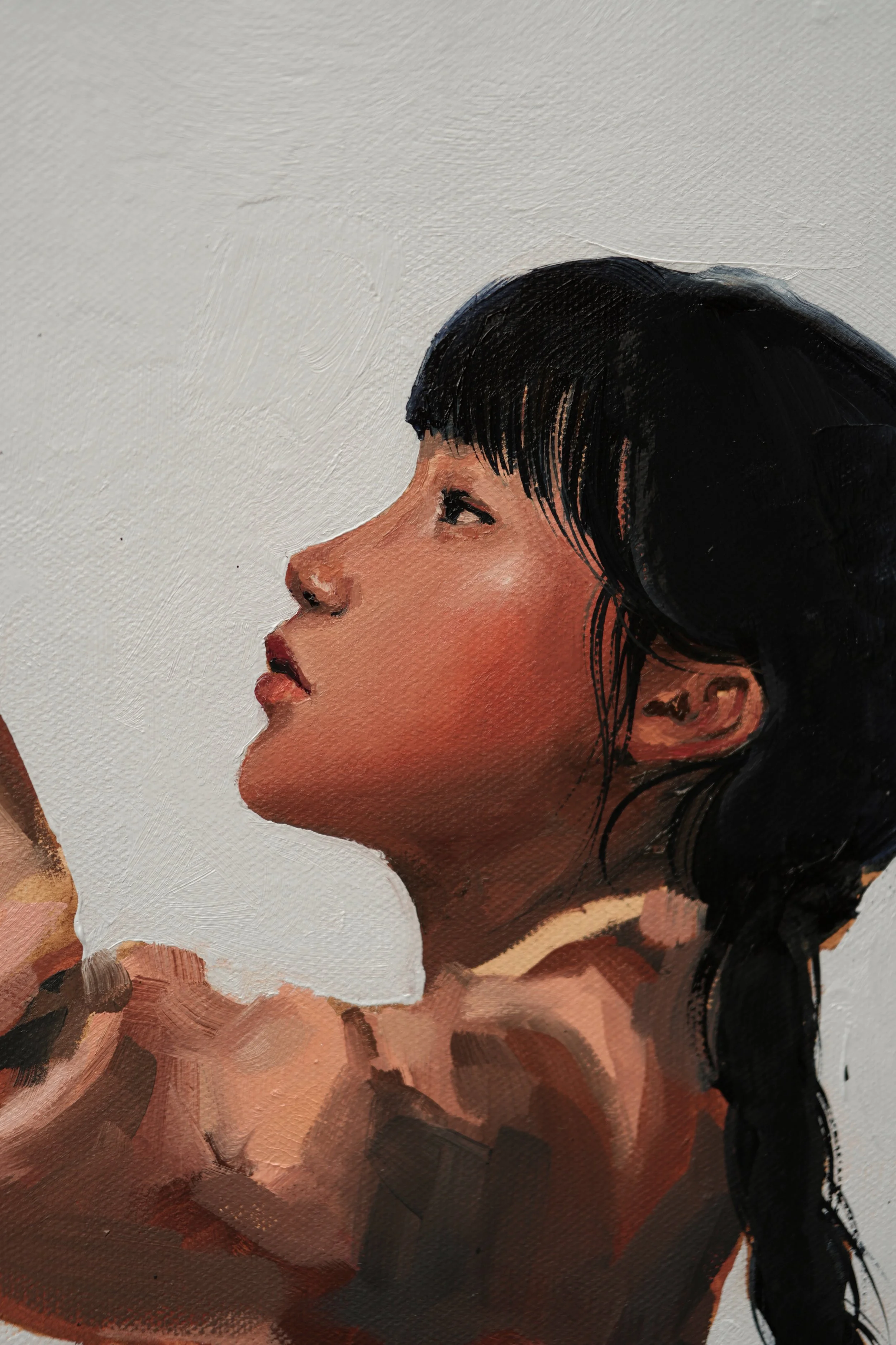Detail of the girl's face in profile, with dark bangs and braids, looking up at the tiger, oil on linen by Marina Ogai