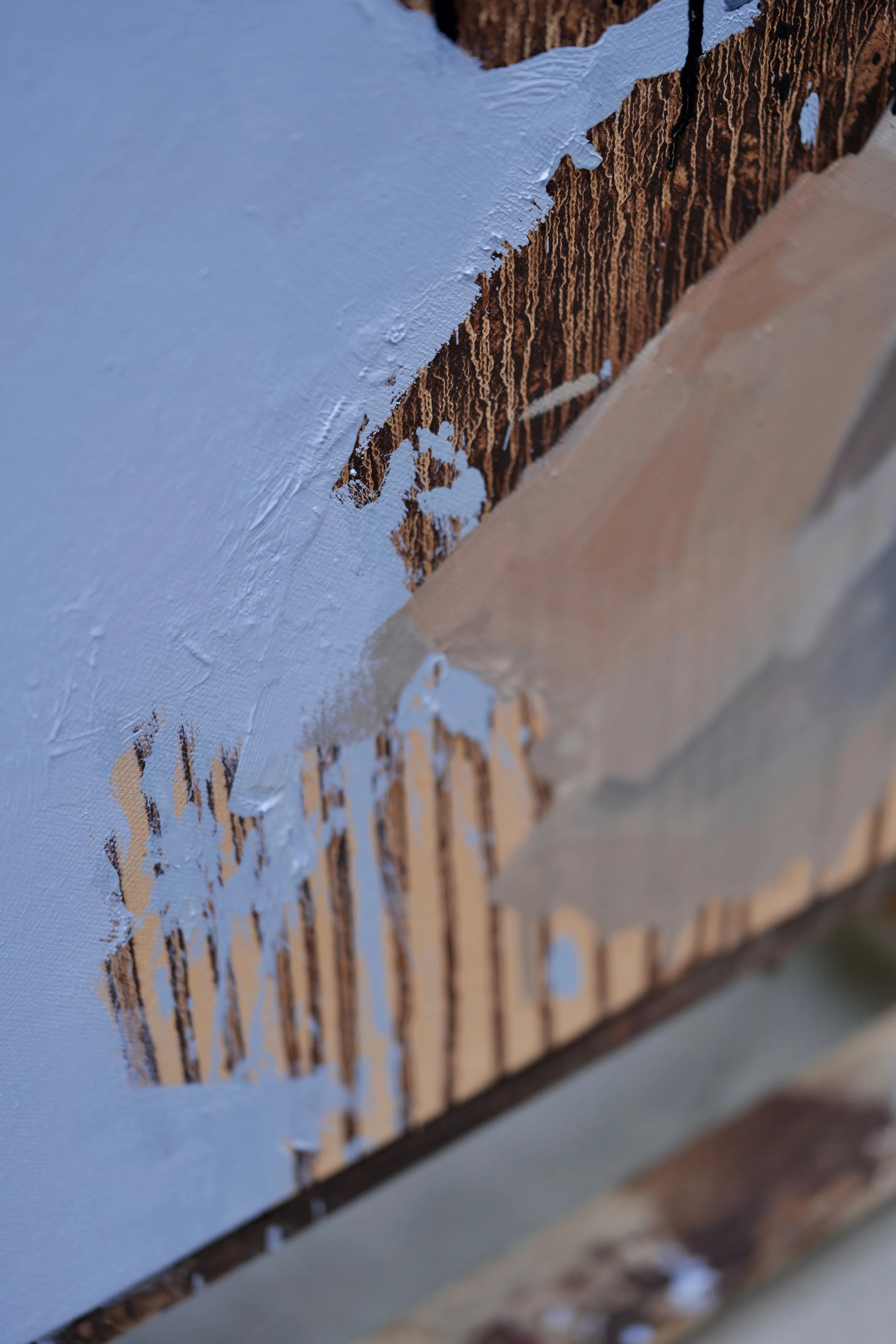 Cairn, detail – the raw unpainted edge of the linen with ochre drips running into the blue ground