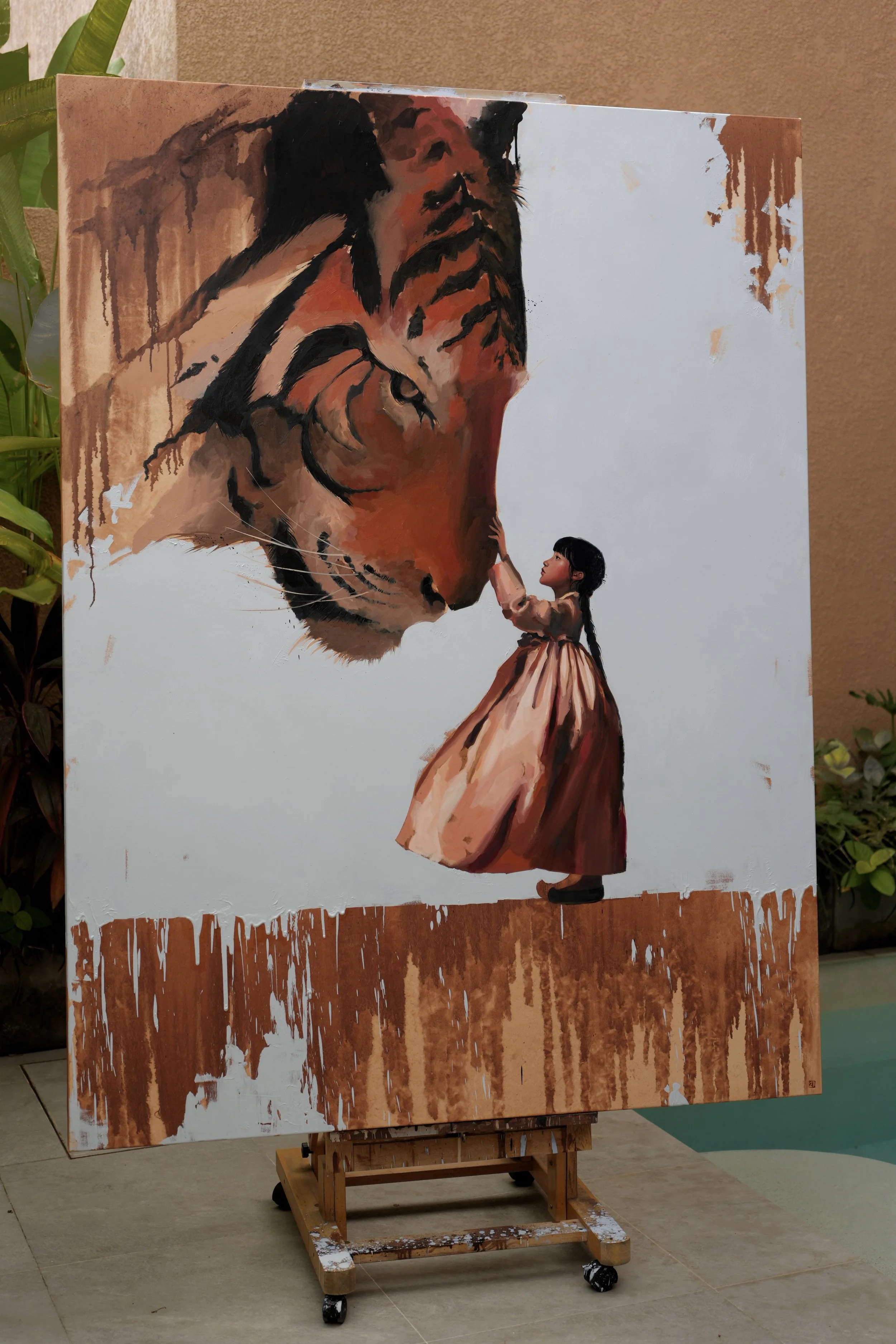 Horangi, a large oil on linen of a girl and a giant tiger, leaning against a wall among tropical plants, by Marina Ogai
