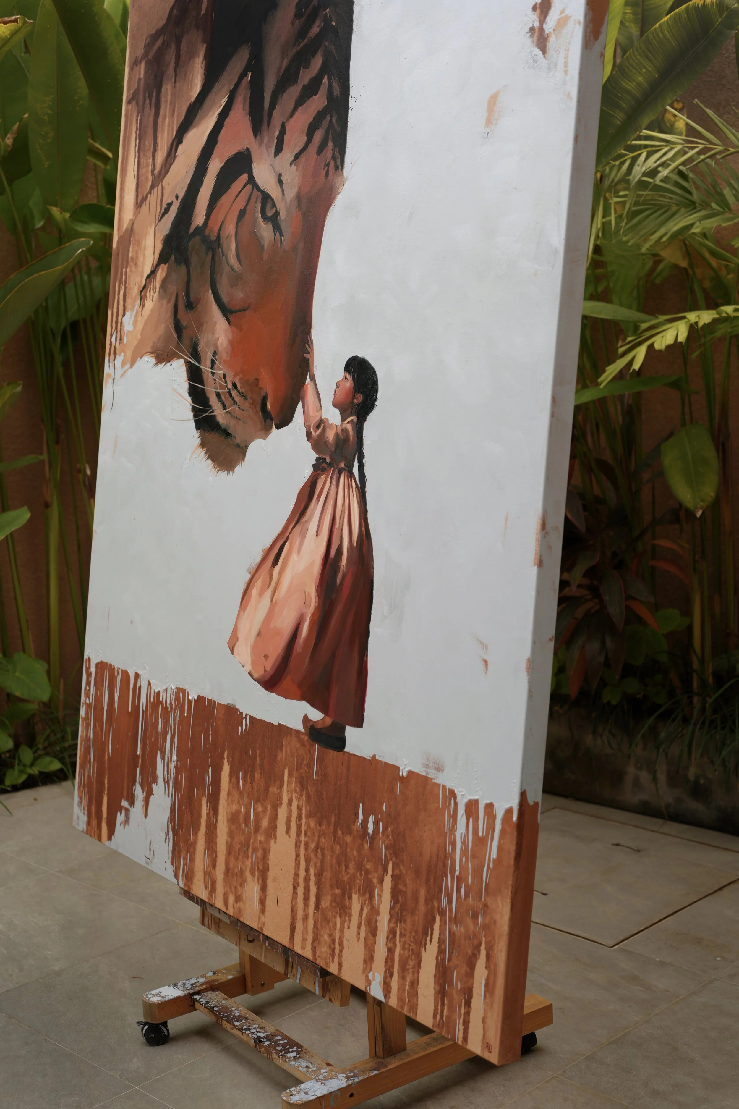 Side view of the painting Horangi on stretched linen, showing the canvas depth and the girl beneath the tiger, by Marina Ogai