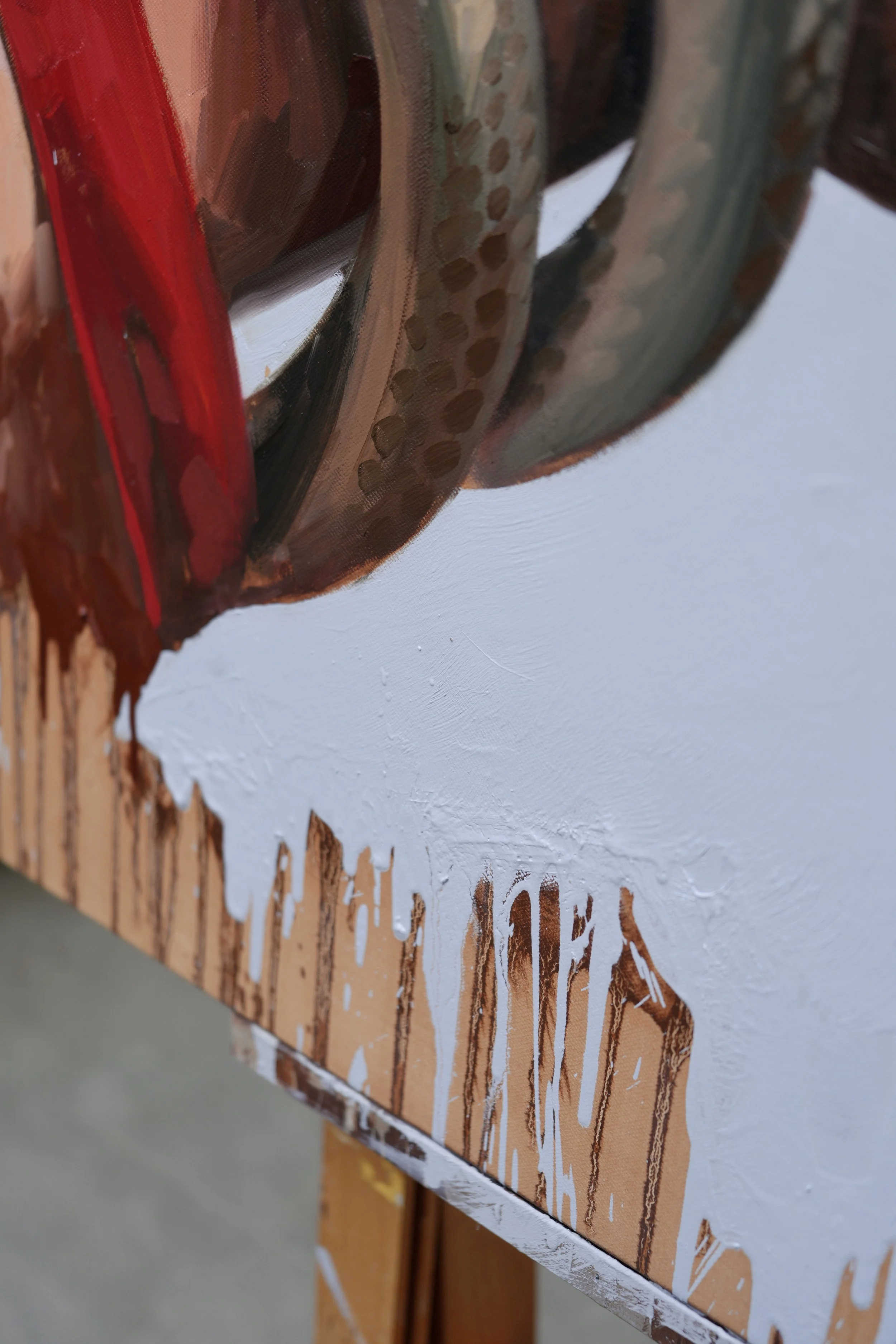 Detail of the red sleeve, snake coils and ochre drips along the lower edge of the canvas, Sagwa by Marina Ogai
