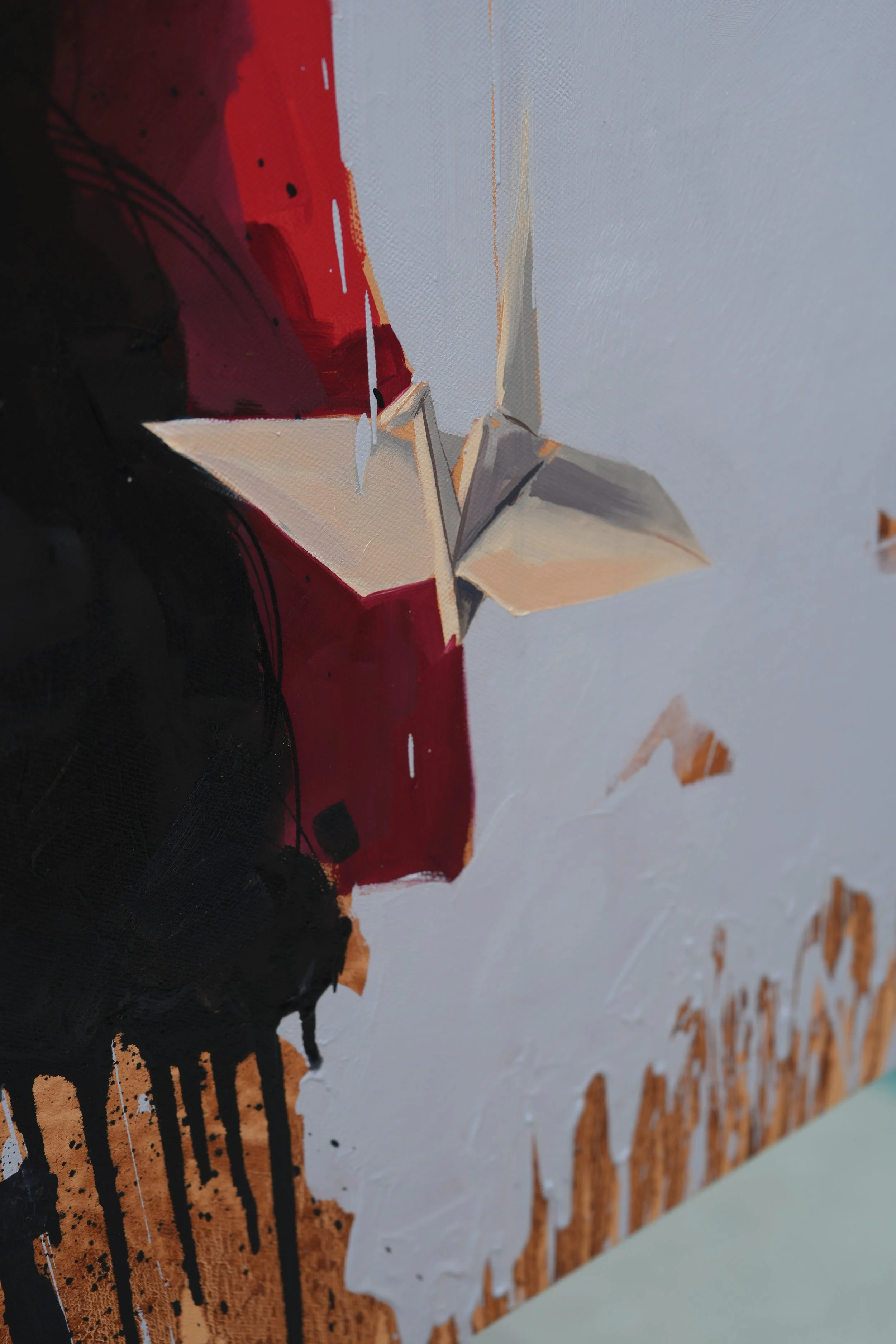 Red ribbon, dark braid and a white paper crane on a pale grey ground, detail of Jeopgi by Marina Ogai