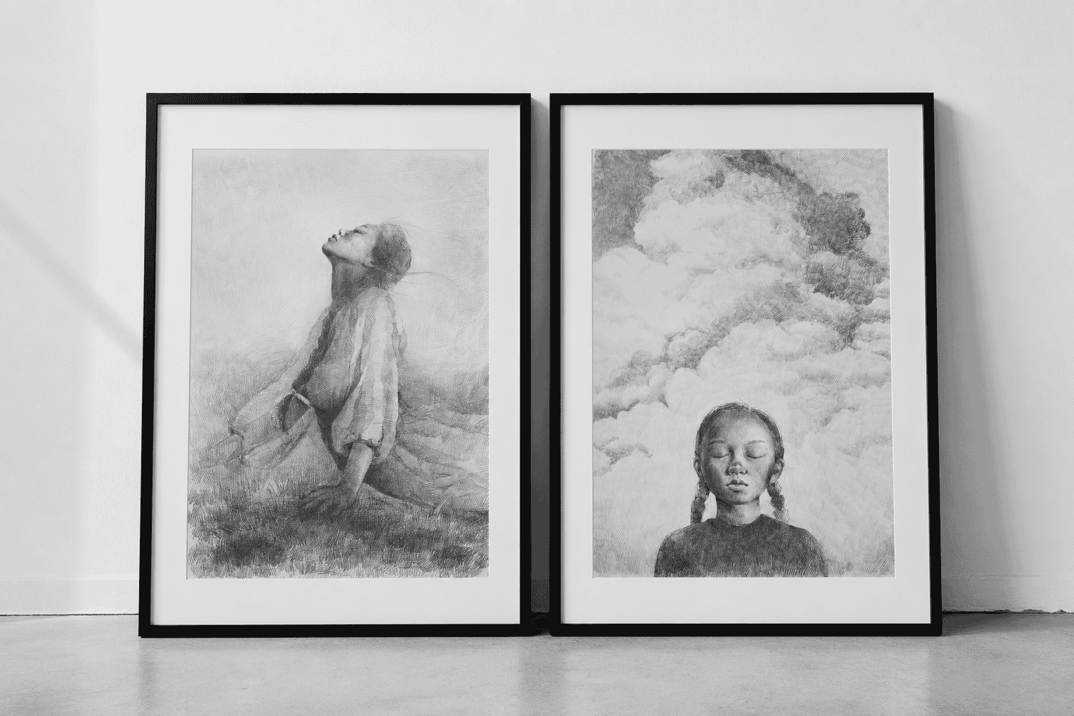 Two framed pencil drawings from The In-Between by Marina Ogai on a white wall