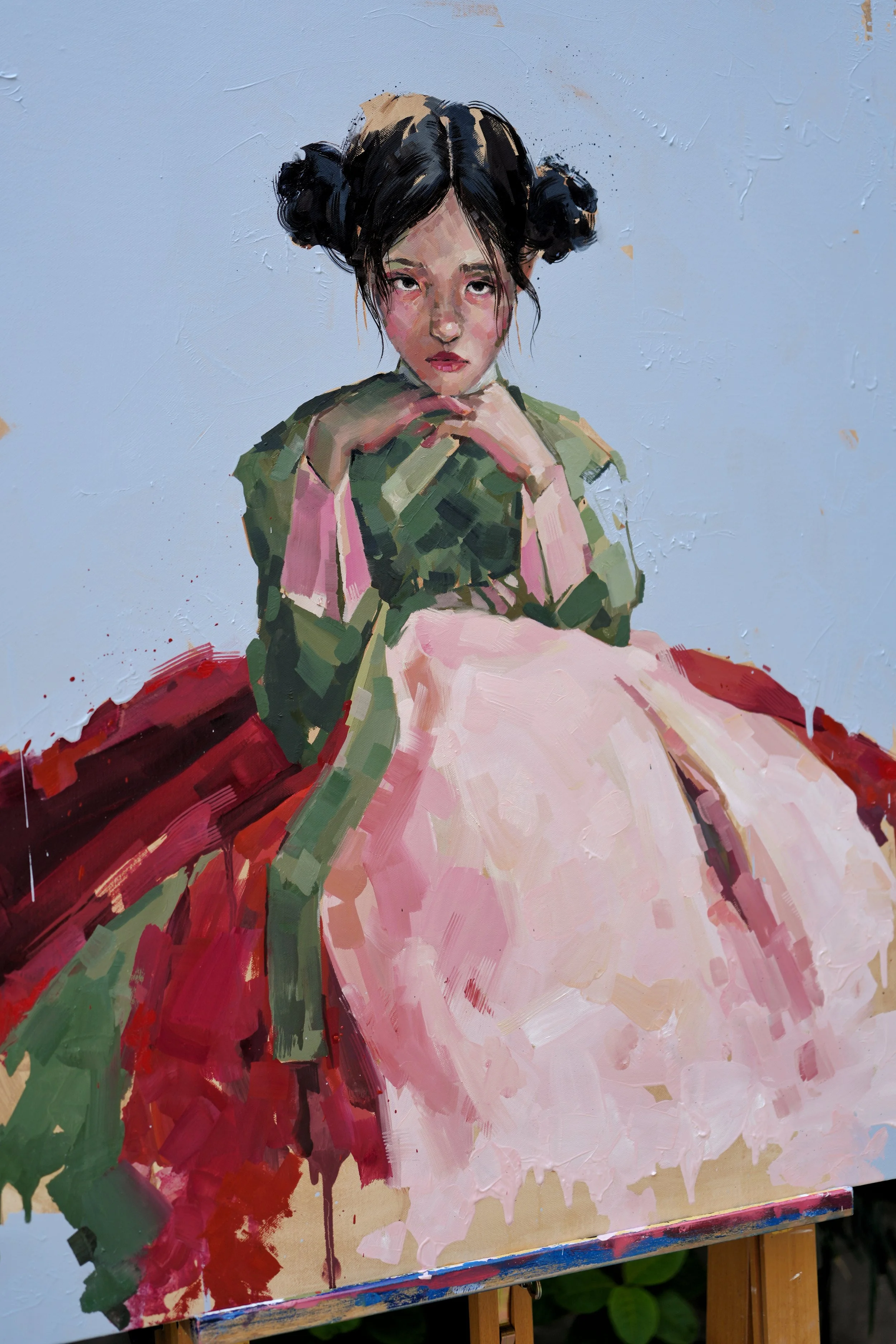 Seated girl in a green jeogori and full pink skirt, black hair in twin buns, red and green brushstrokes behind her, oil on canvas, from Given by Marina Ogai