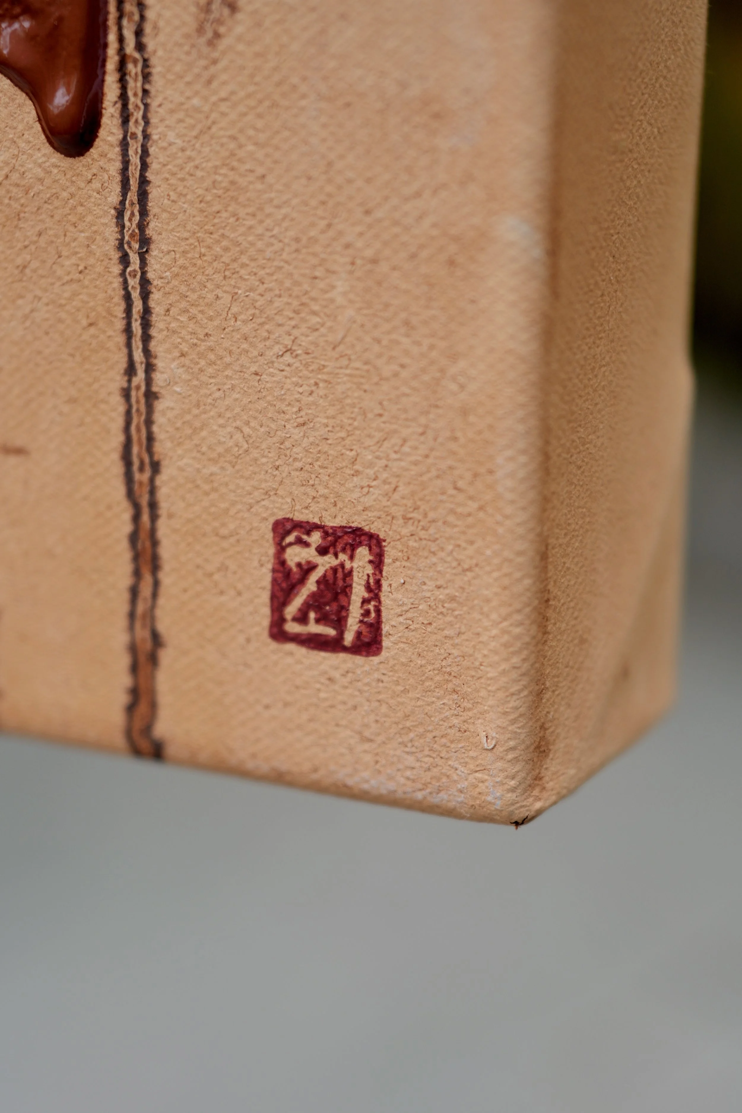 Side edge of the linen canvas with the artist's red seal, Shinmok by Marina Ogai