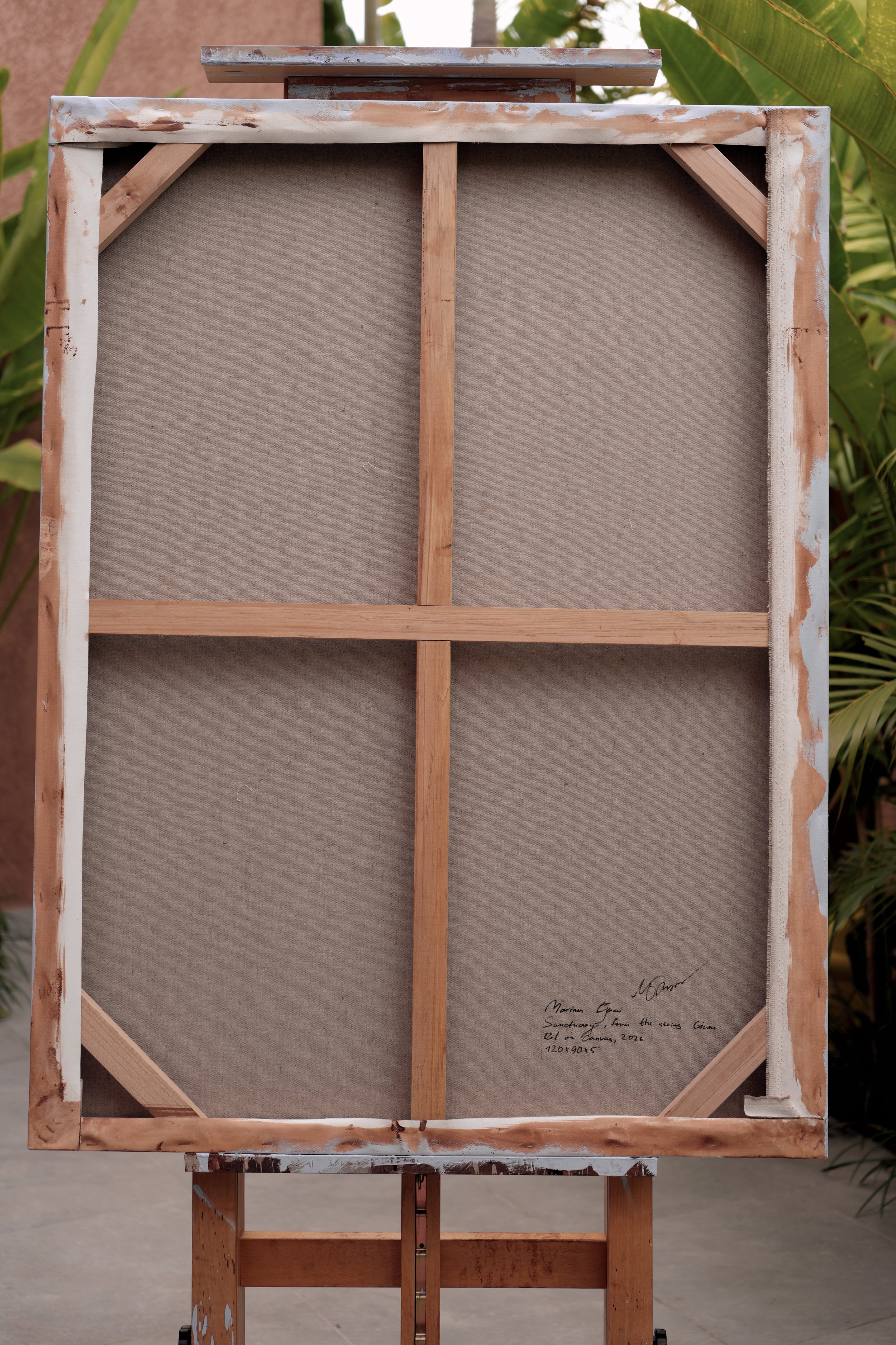 Back of the stretched linen canvas with the handwritten title and signature, Sanctuary by Marina Ogai