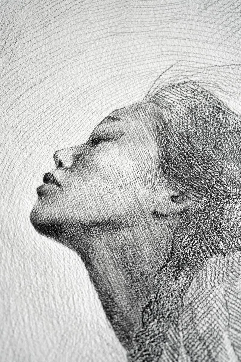A young woman kneeling with her head tilted back and eyes closed, drapery falling from her shoulders, dense pencil hatching, from The In-Between by Marina Ogai