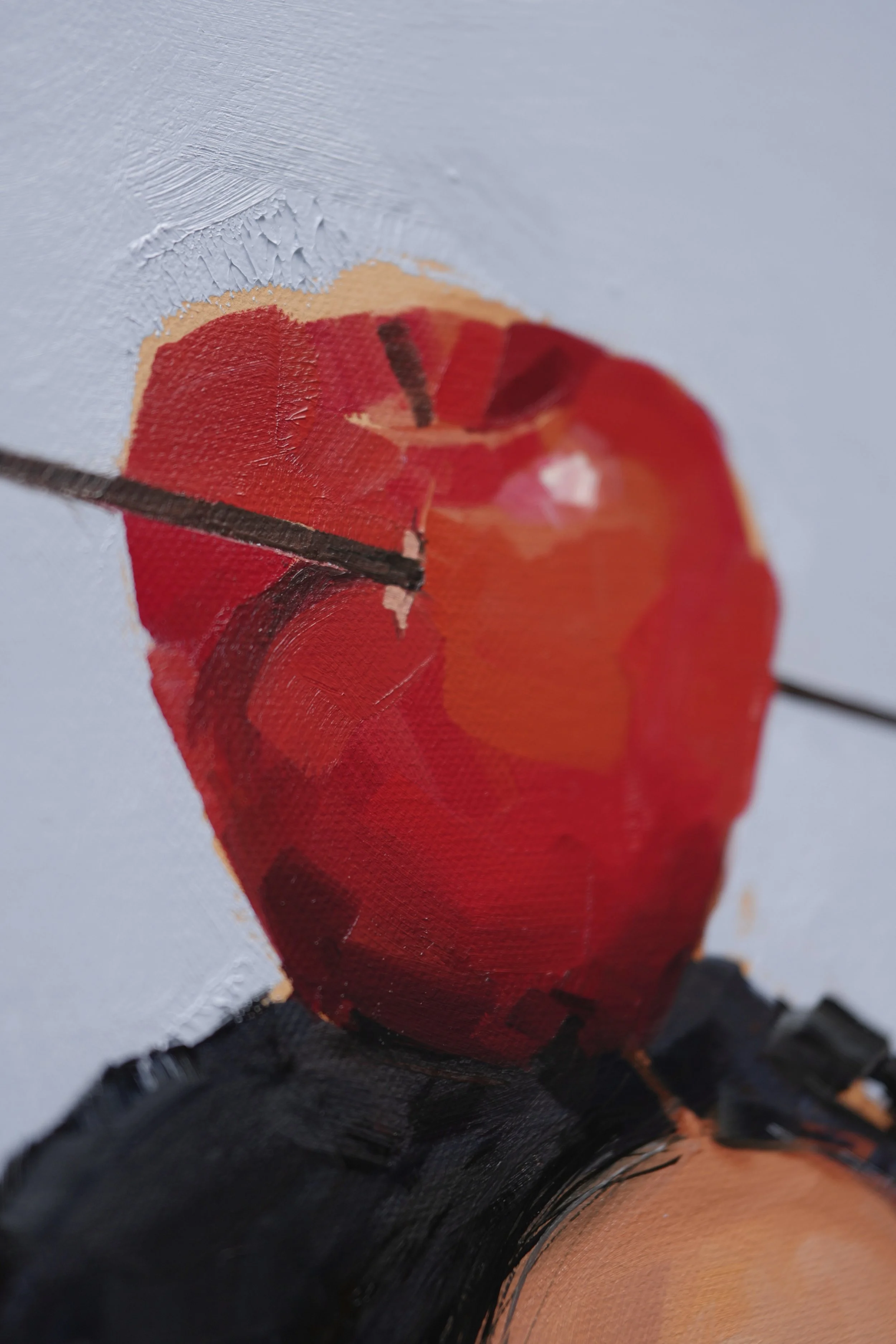 Close-up of a red apple pierced by an arrow in broad oil strokes – detail of The Aftermath by Marina Ogai