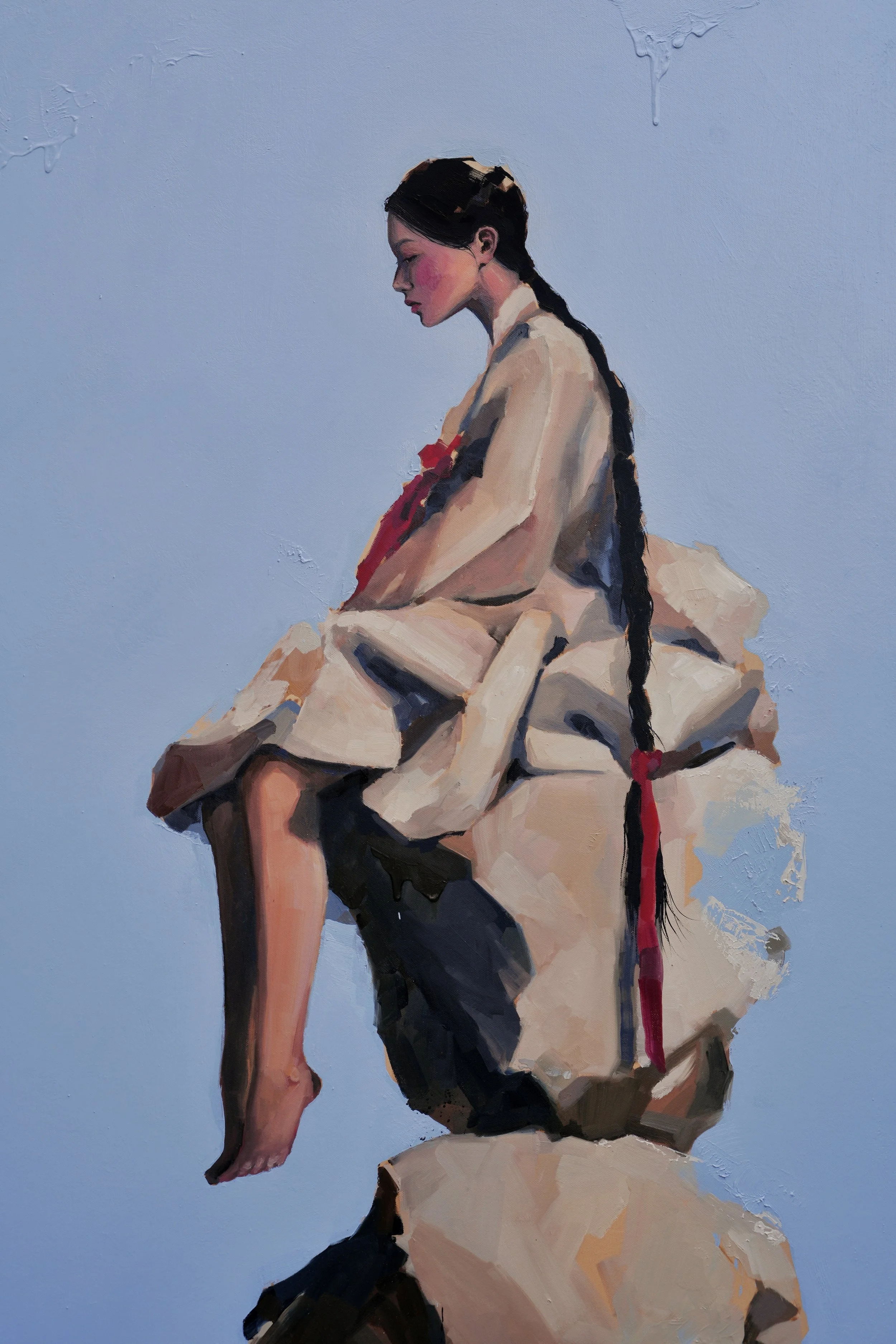 Cairn, detail – the seated figure in hanbok, long black braid and red ribbon, painted in soft ochre and grey