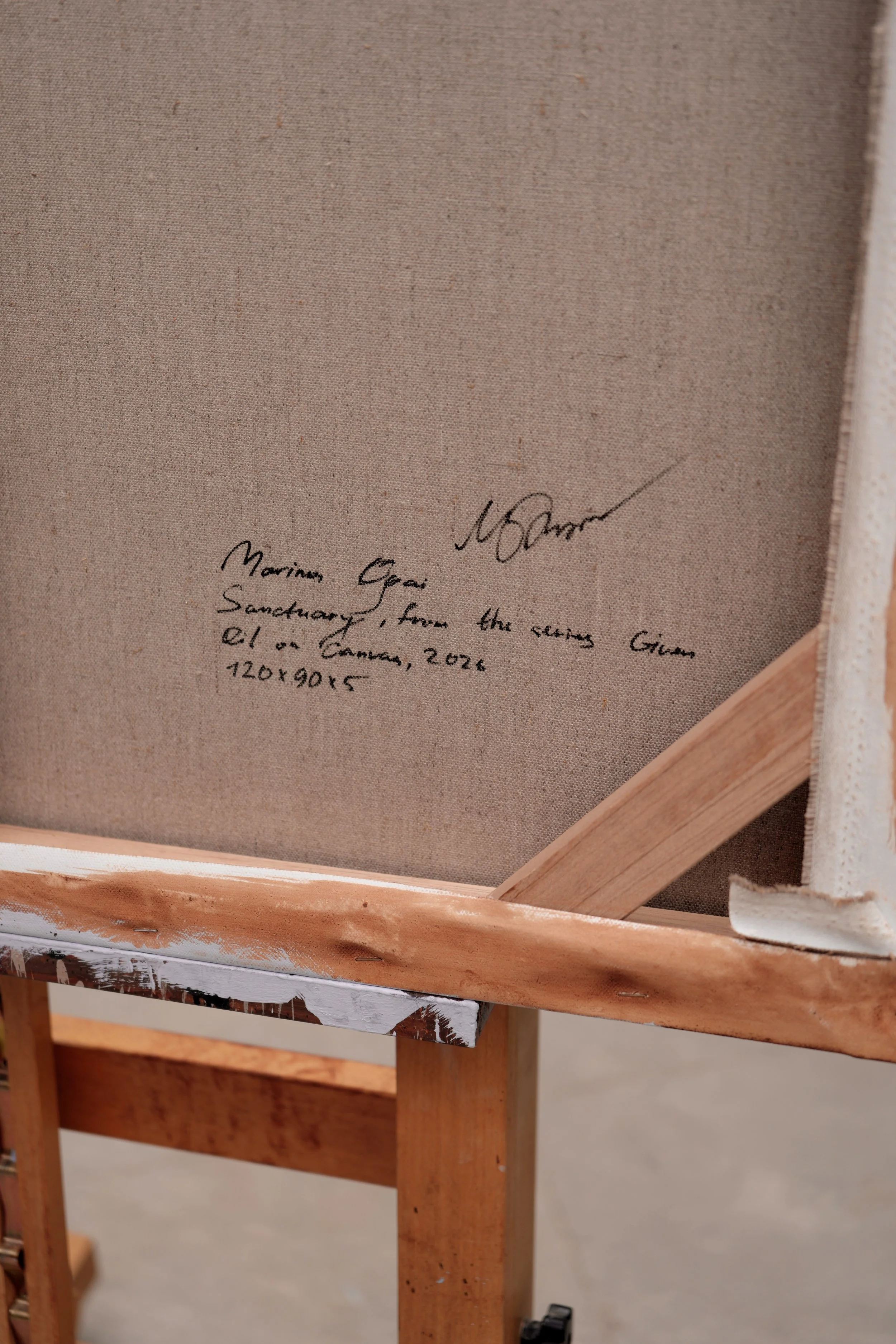 Back of the stretched linen canvas with the handwritten title and signature, Sanctuary by Marina Ogai