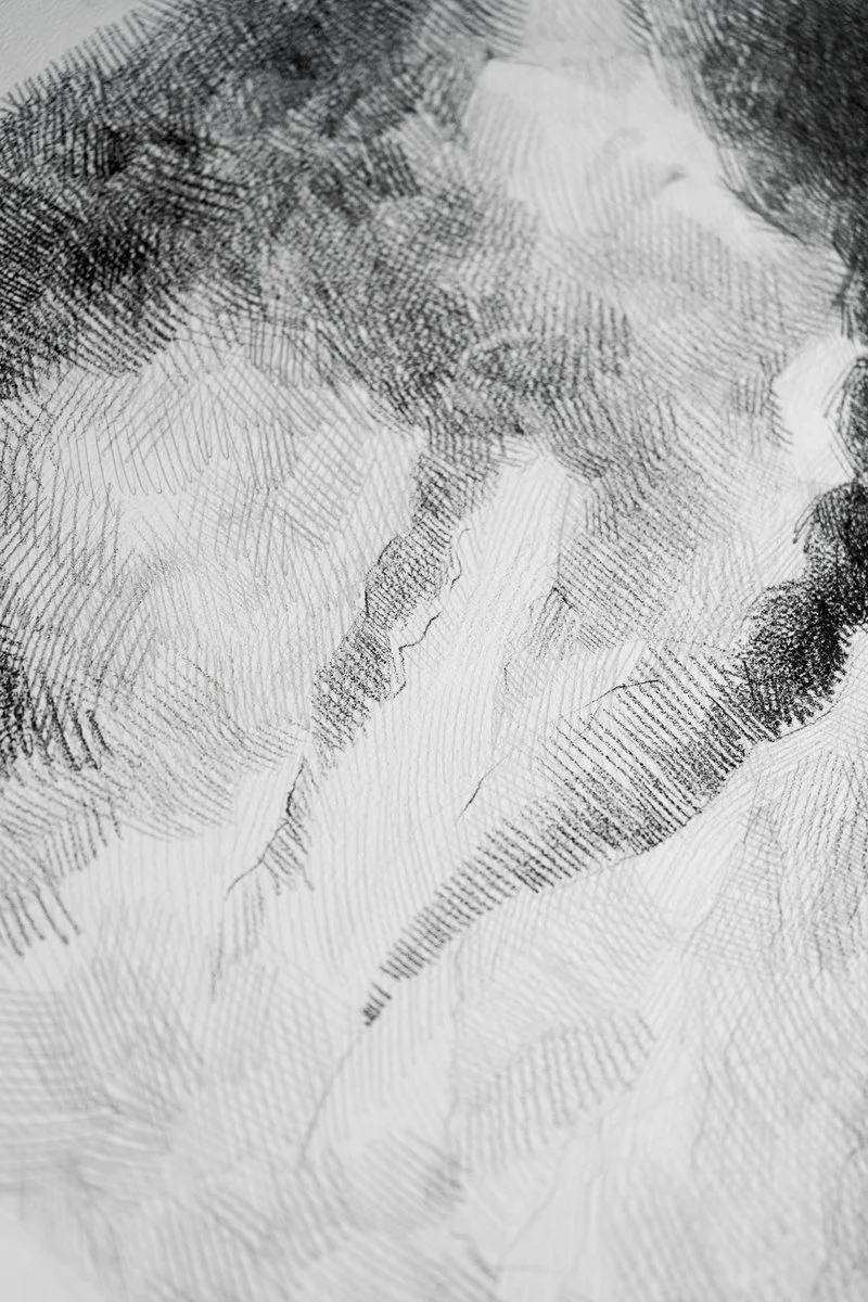 A young woman's profile in motion with a second faint profile behind her, dense pencil hatching, from The In-Between by Marina Ogai