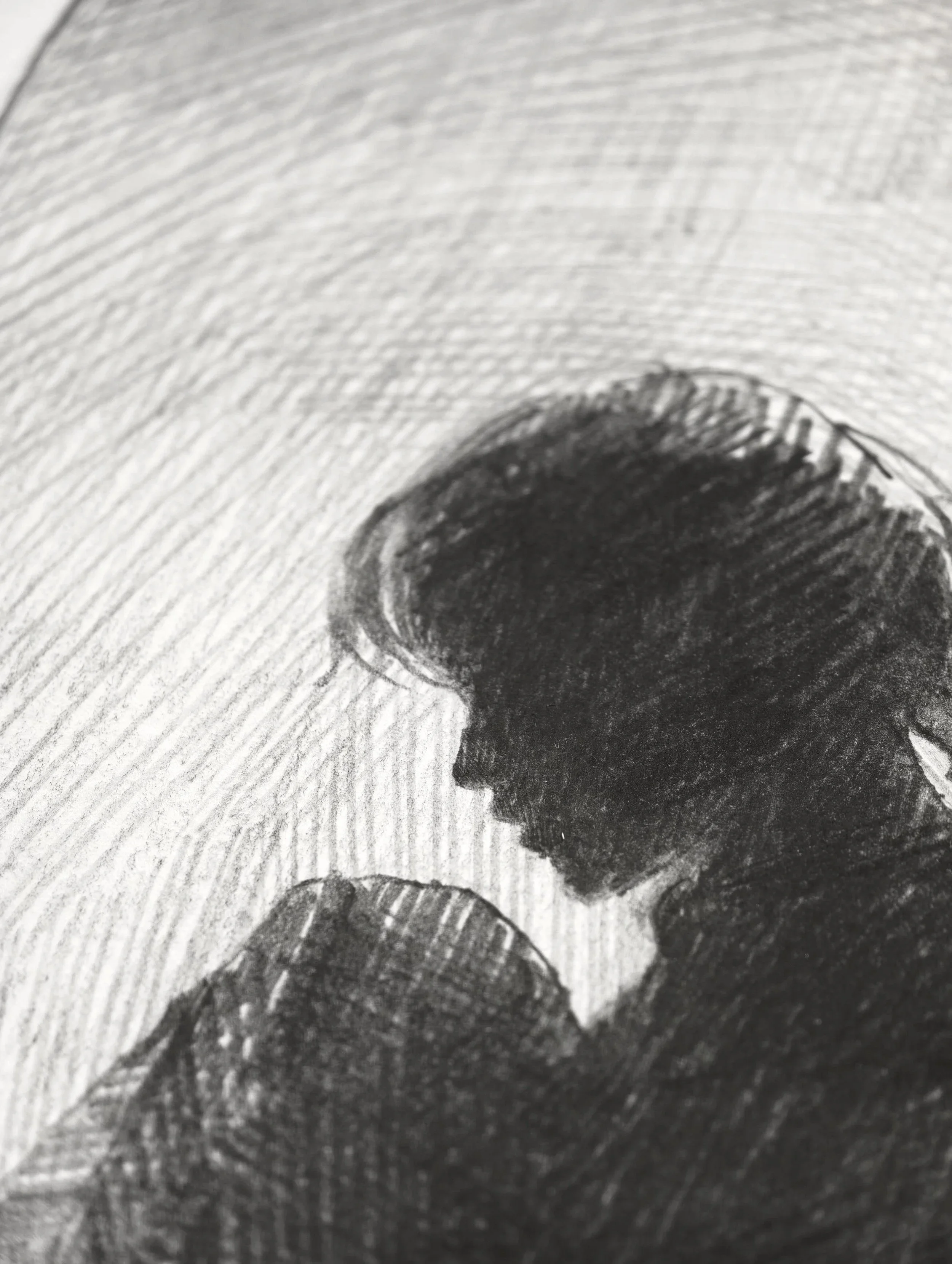 Profile of a lowered head with loose dark hair, radiating pencil strokes in the background, detail from Letting Go by Marina Ogai
