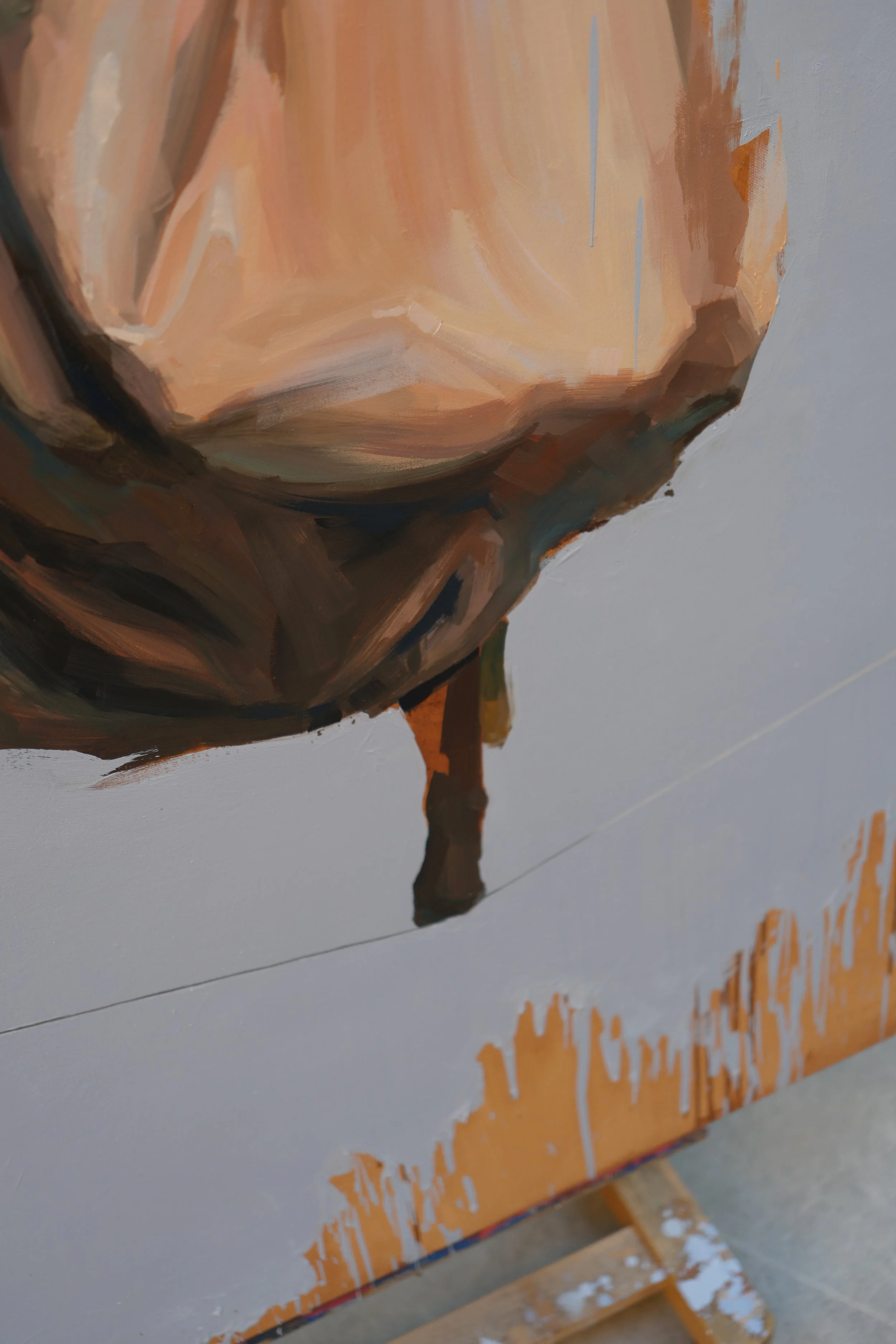 Detail of a pale skirt above a thin line and raw ochre drips along the canvas edge, oil on linen, from Given by Marina Ogai
