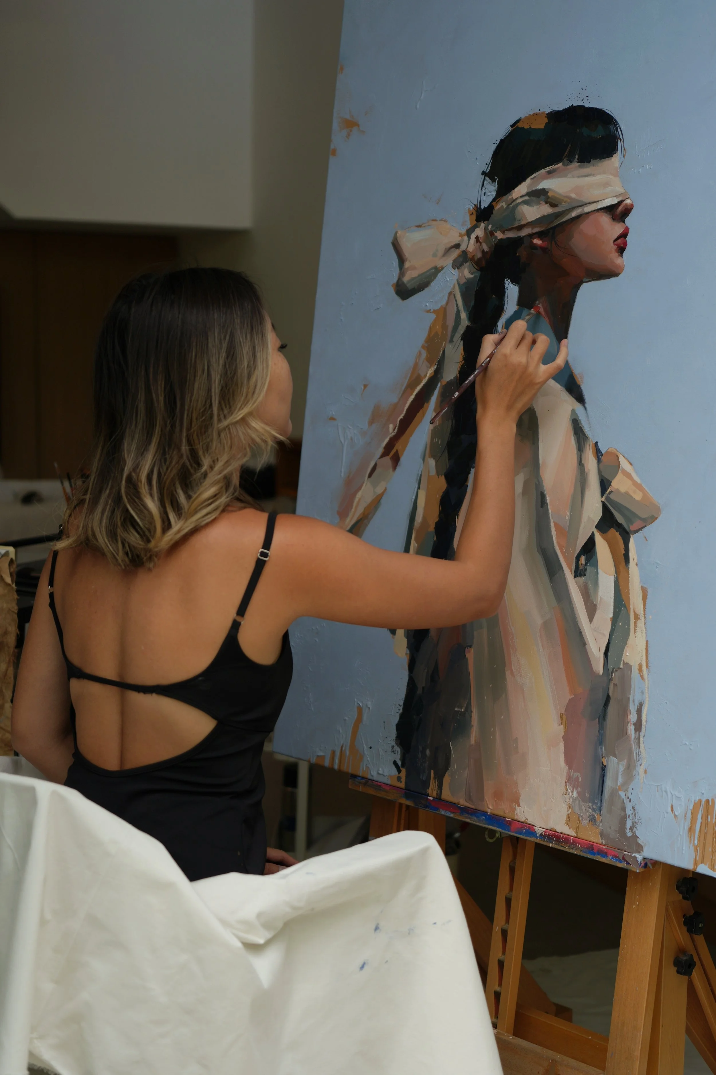Marina Ogai at the easel working on the blindfolded figure in hanbok, oil on linen in progress, from Given