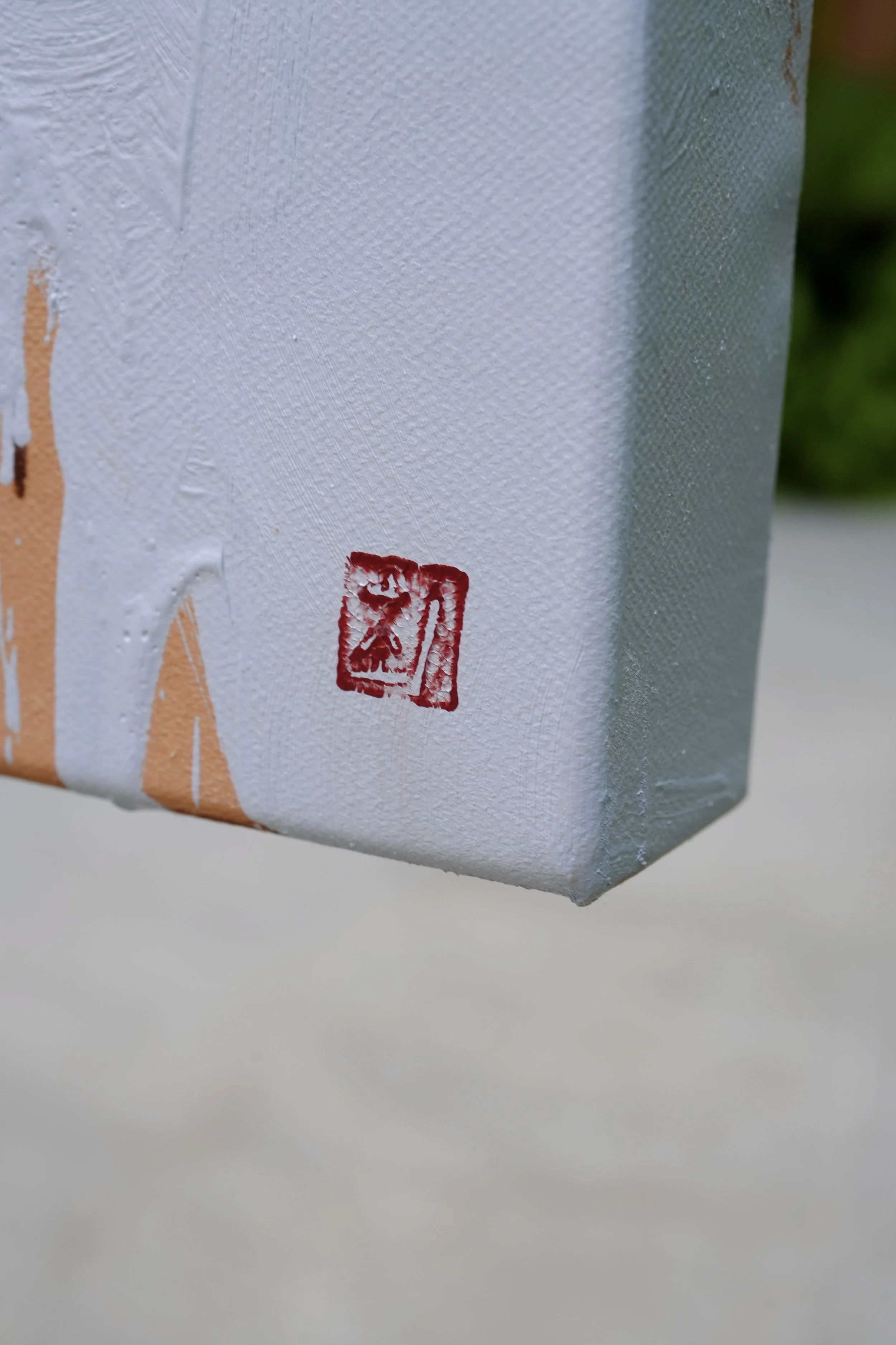 Side edge of the linen canvas with the artist's red seal, Sagwa by Marina Ogai