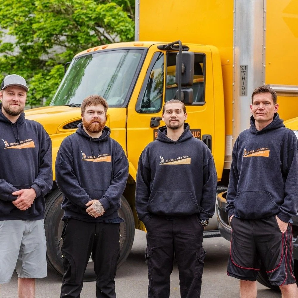 Four Butterfield crew members standing in front of a moving truck, office relocation in Salem